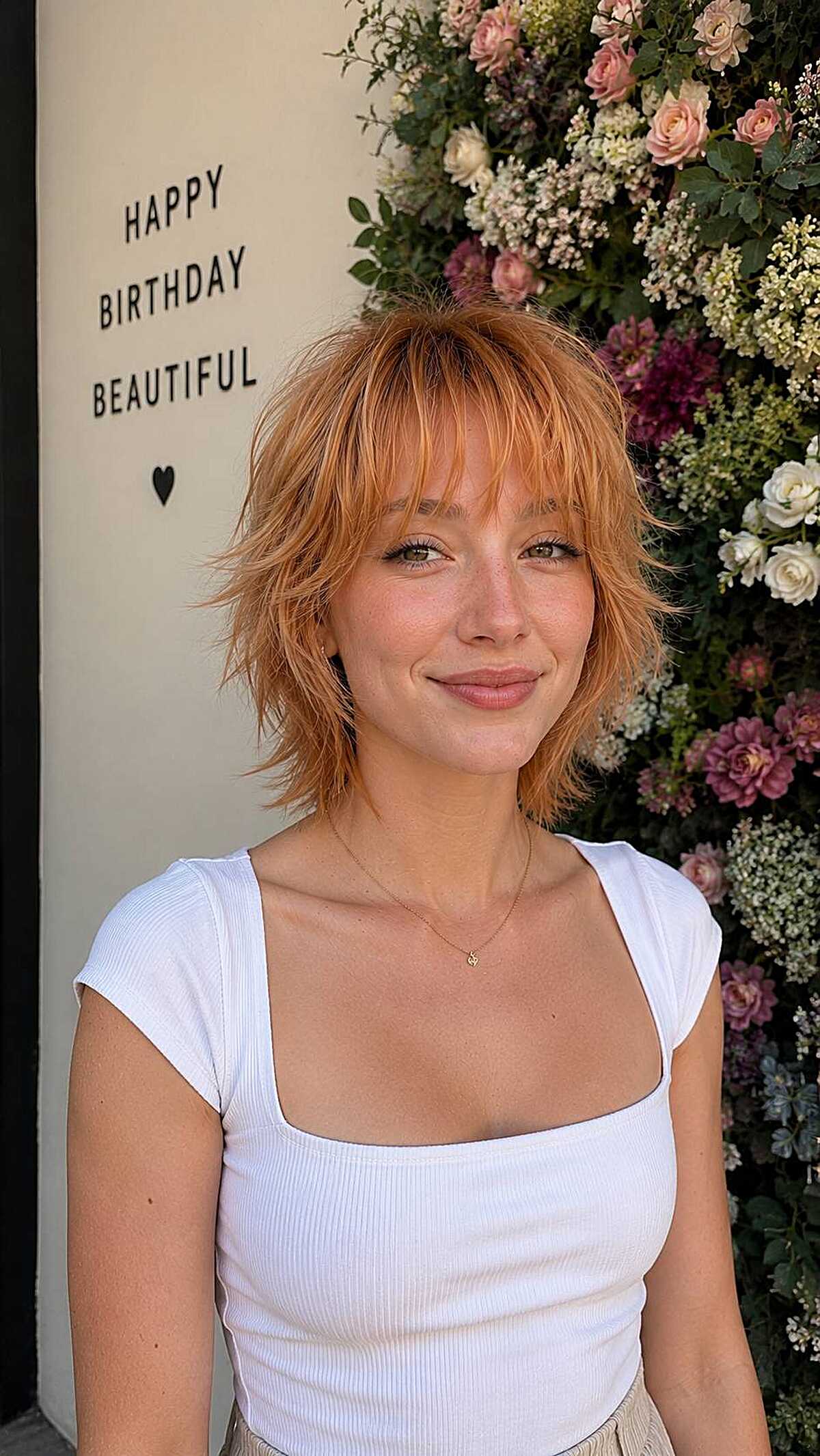 Short peach orange shaggy bob with choppy bangs