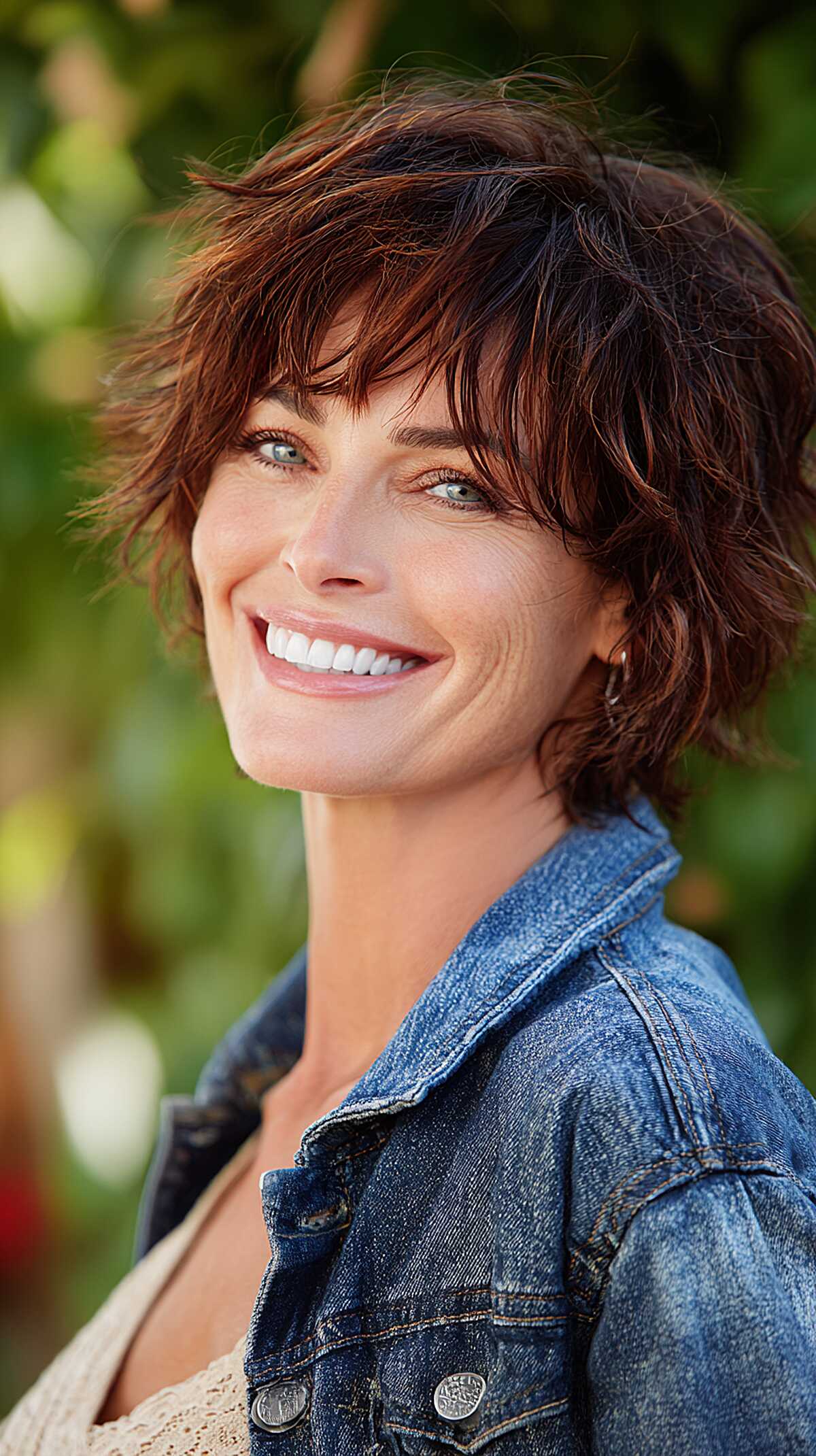 Wavy brunette shag bob with auburn highlights