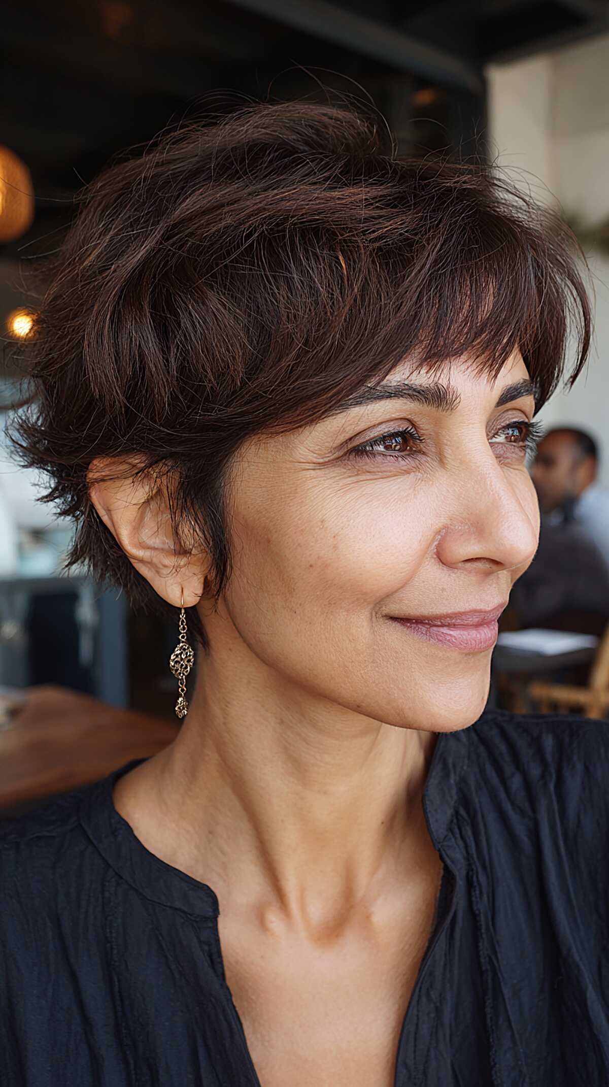 Rich espresso layered mixie with short textured bangs