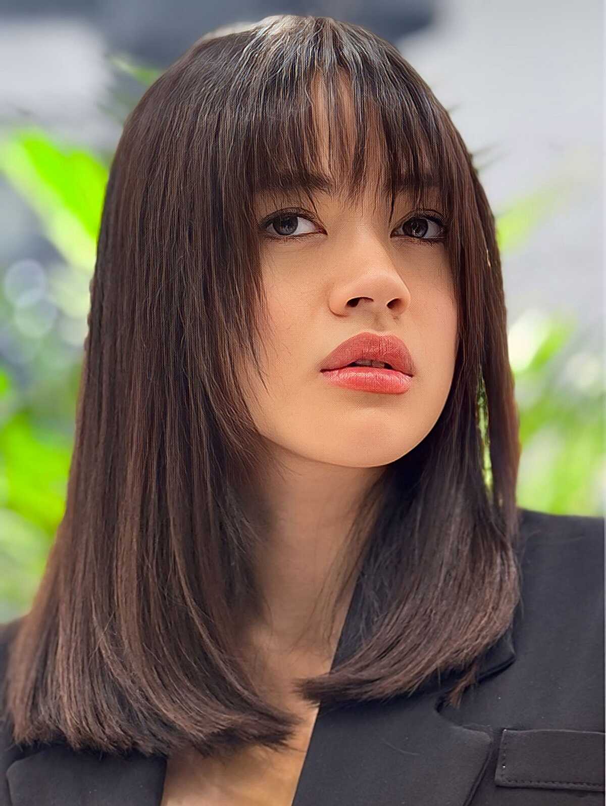 Straight dark brown lob with full blunt bangs