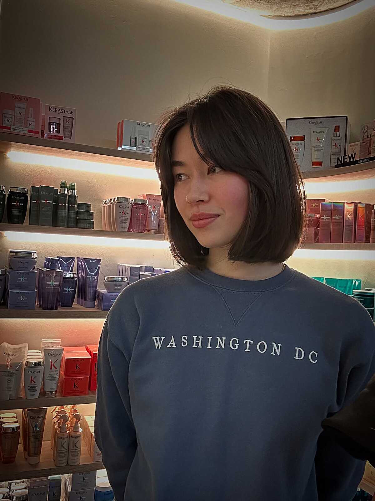 Dark brown chin-length bob with subtle face-framing