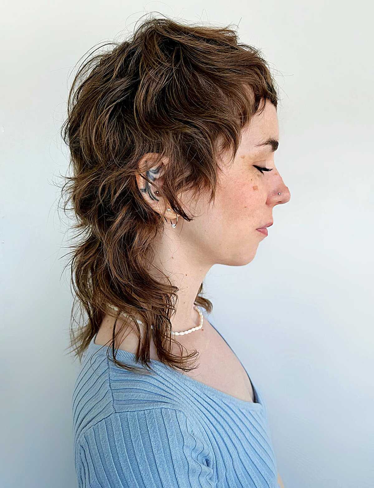 Short wavy mullet with choppy layers and longer back