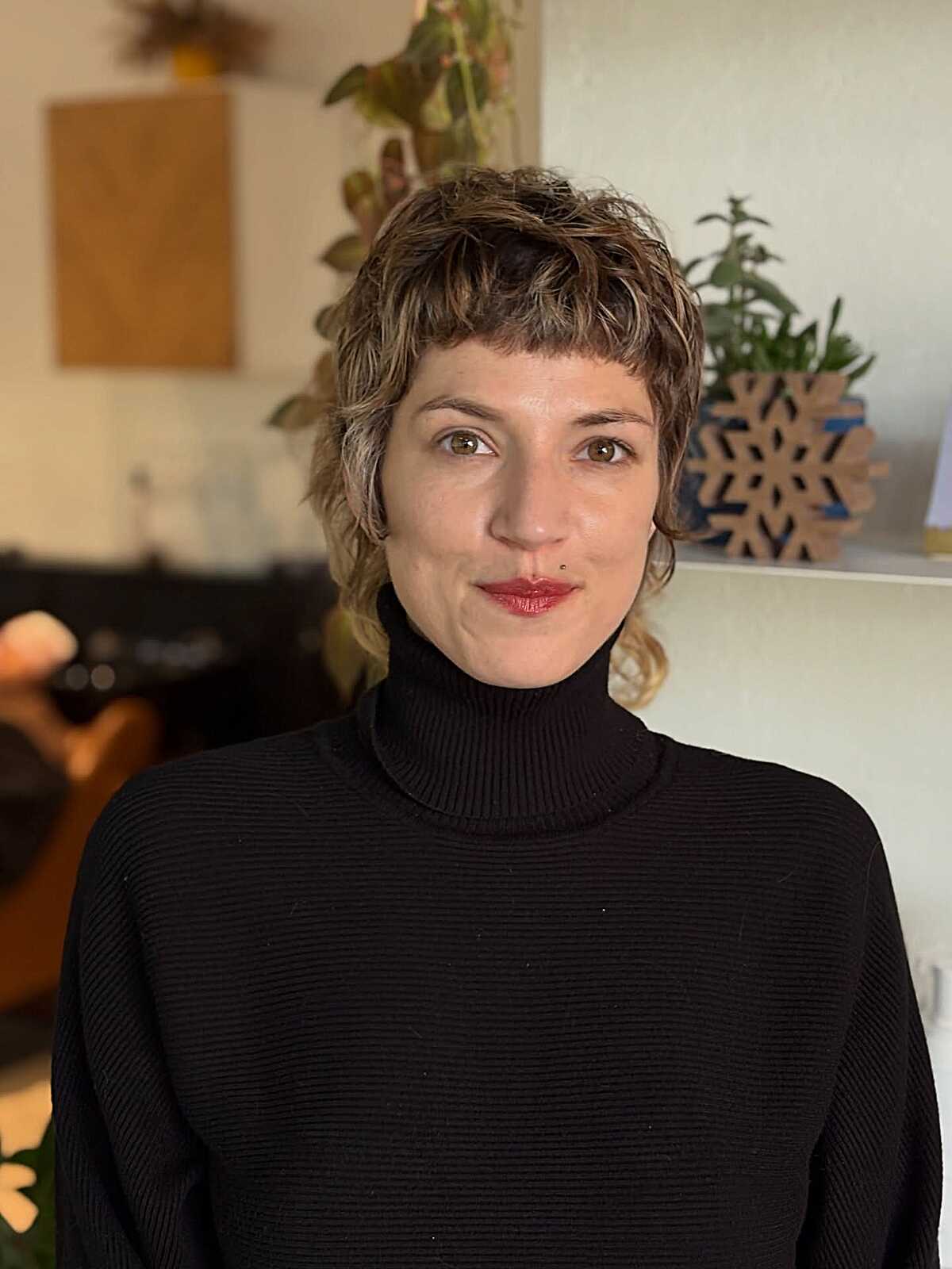 Short textured pixie mullet with blonde highlights