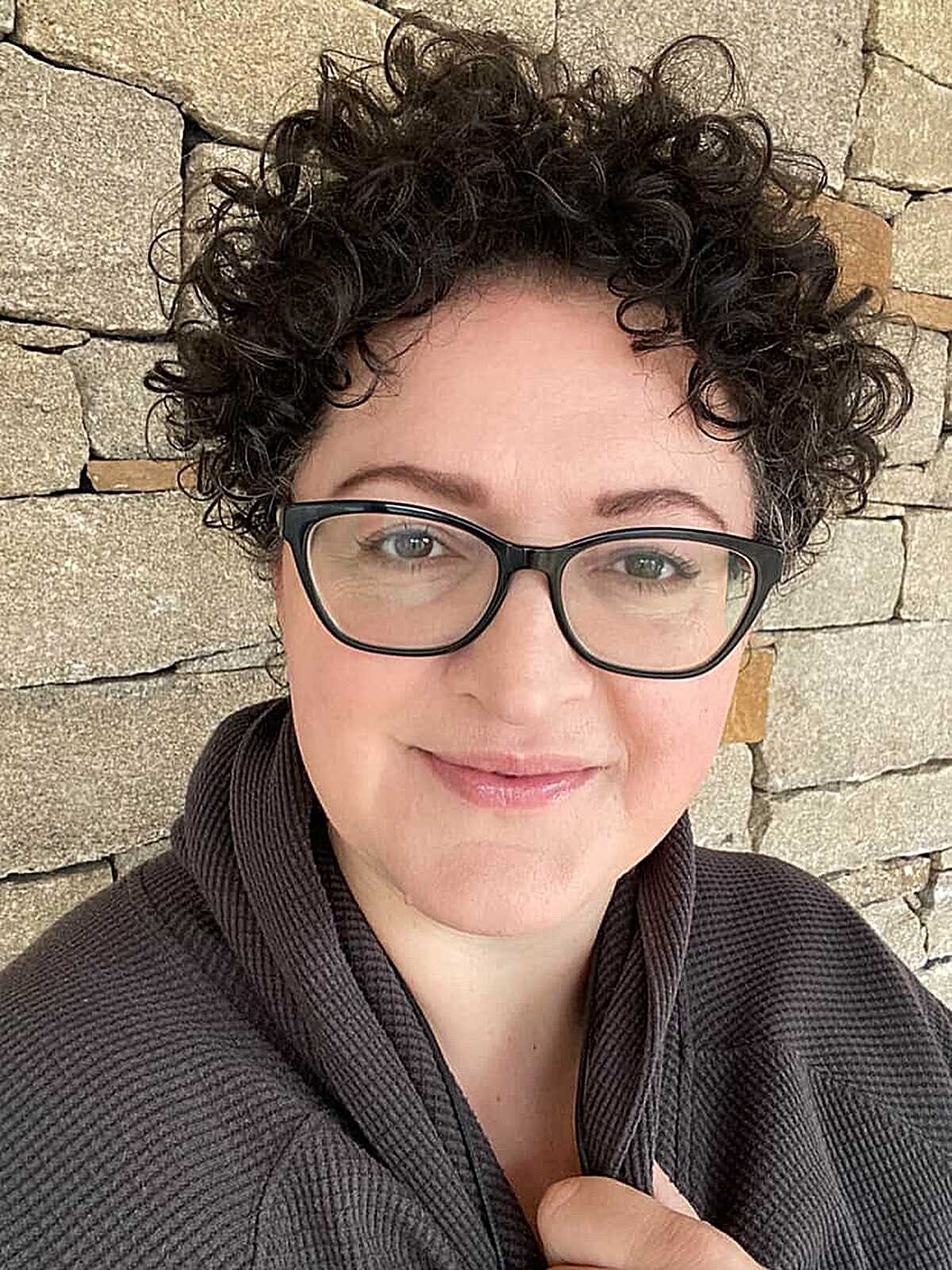 Short dark curly hair with defined tight curls