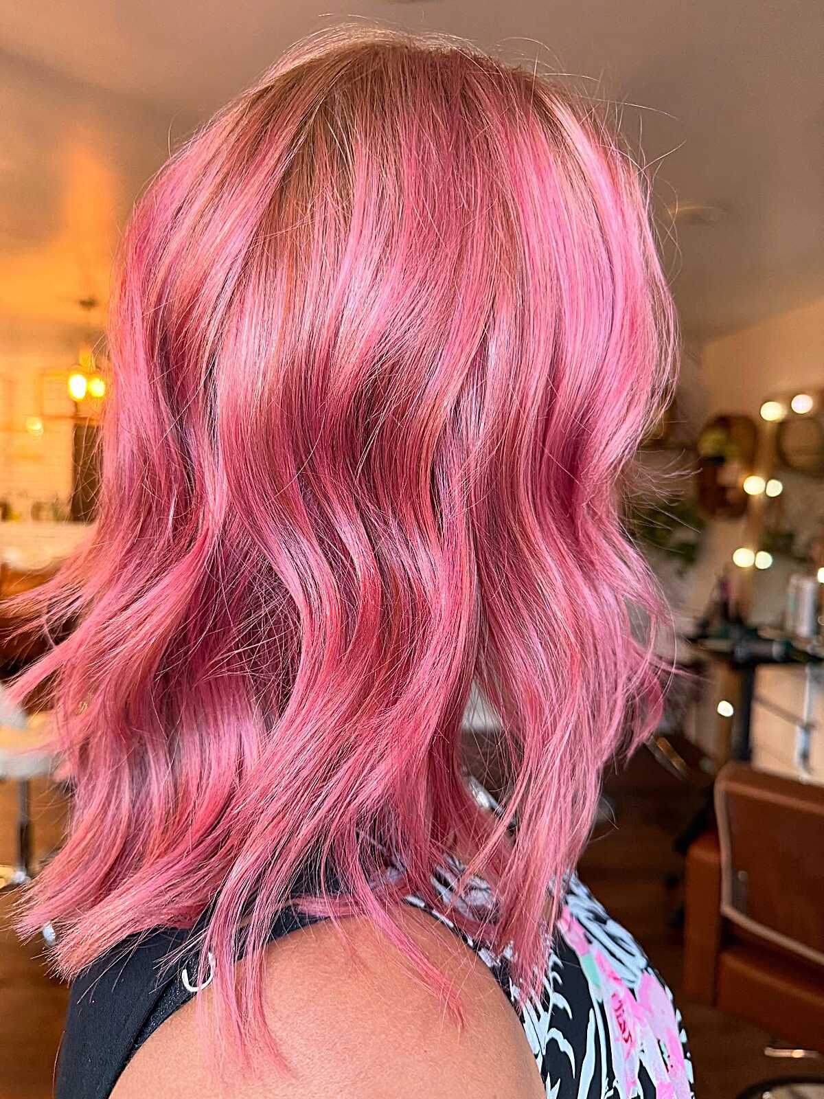 Bright bubblegum pink wavy lob hairstyle