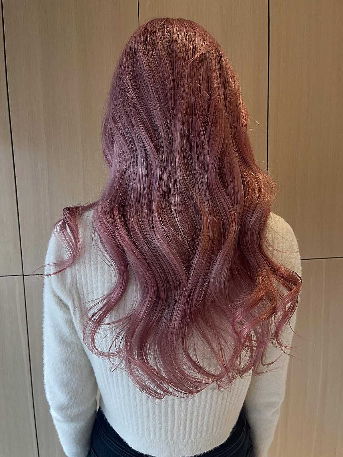 Long faded rosé pink hair with warm copper tones