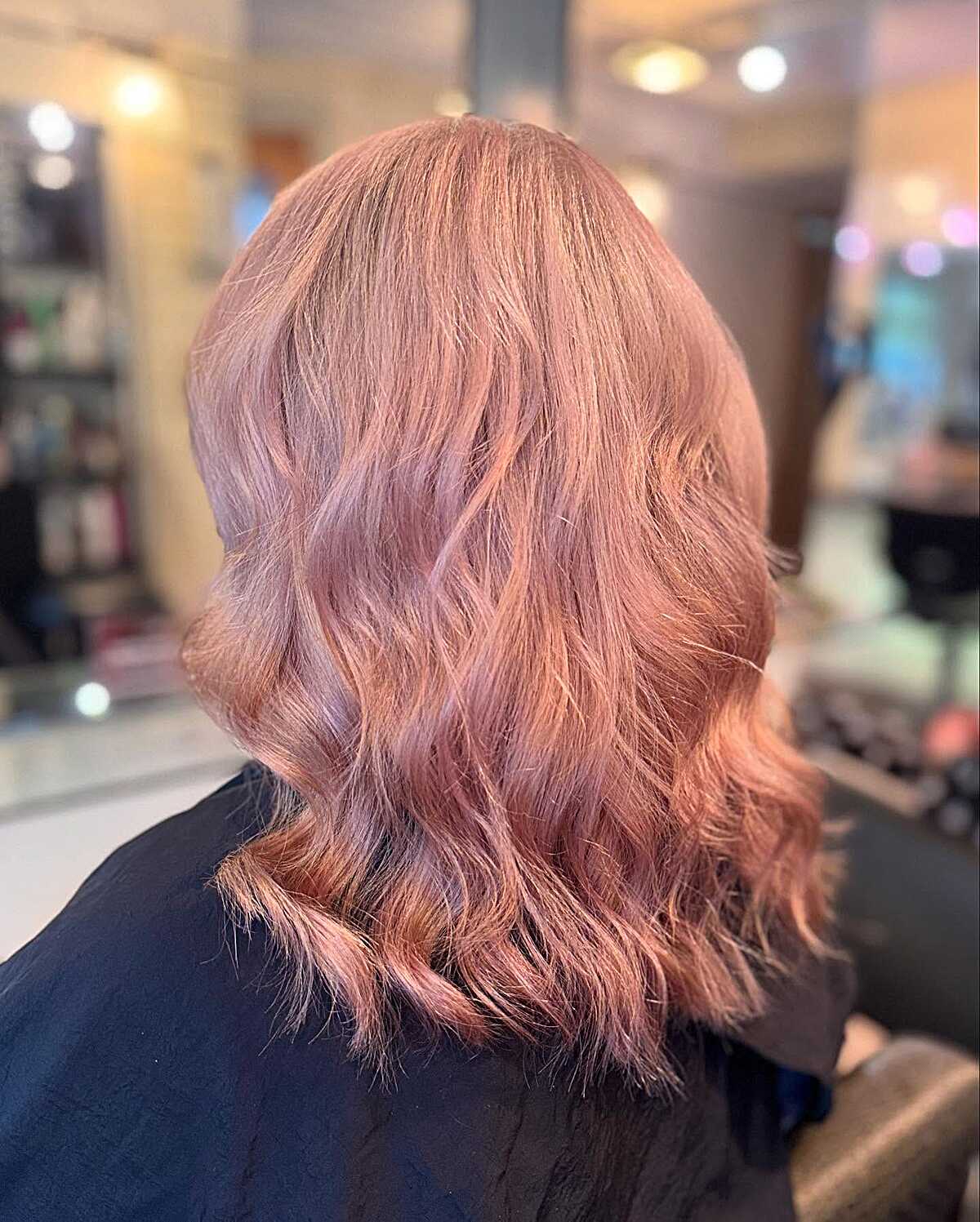 Pale blush pink wavy lob with soft texture
