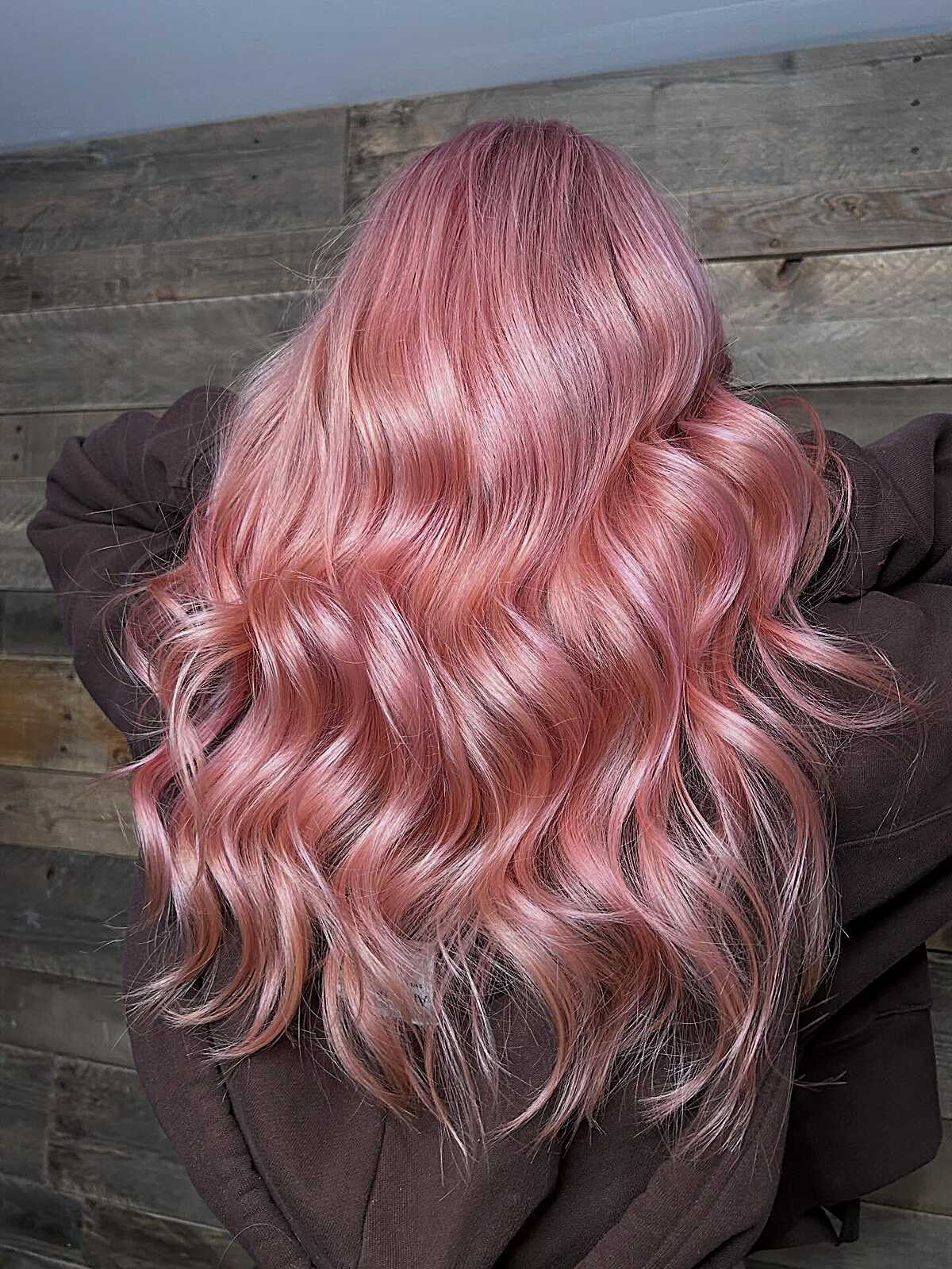 Long peach-kissed rose gold wavy hair