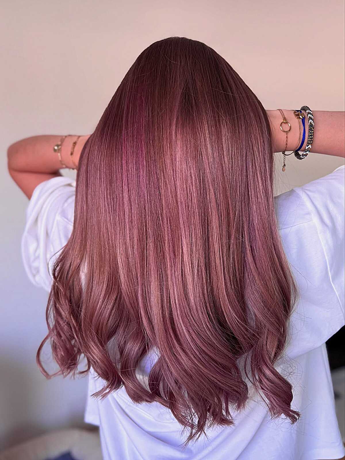 Sleek medium-length mauve rose hair with soft ends