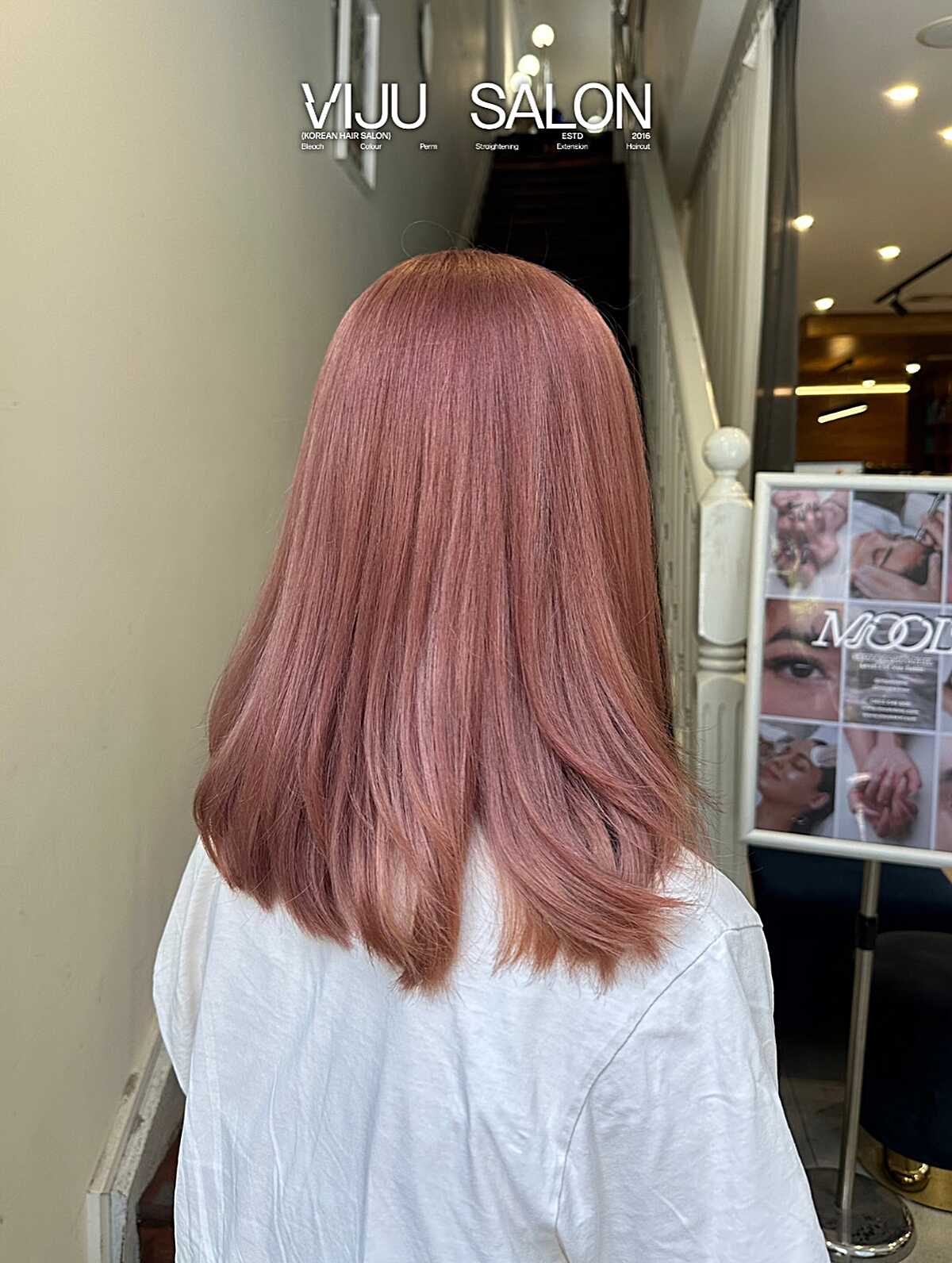 Medium soft rose pink hair with gently flipped ends