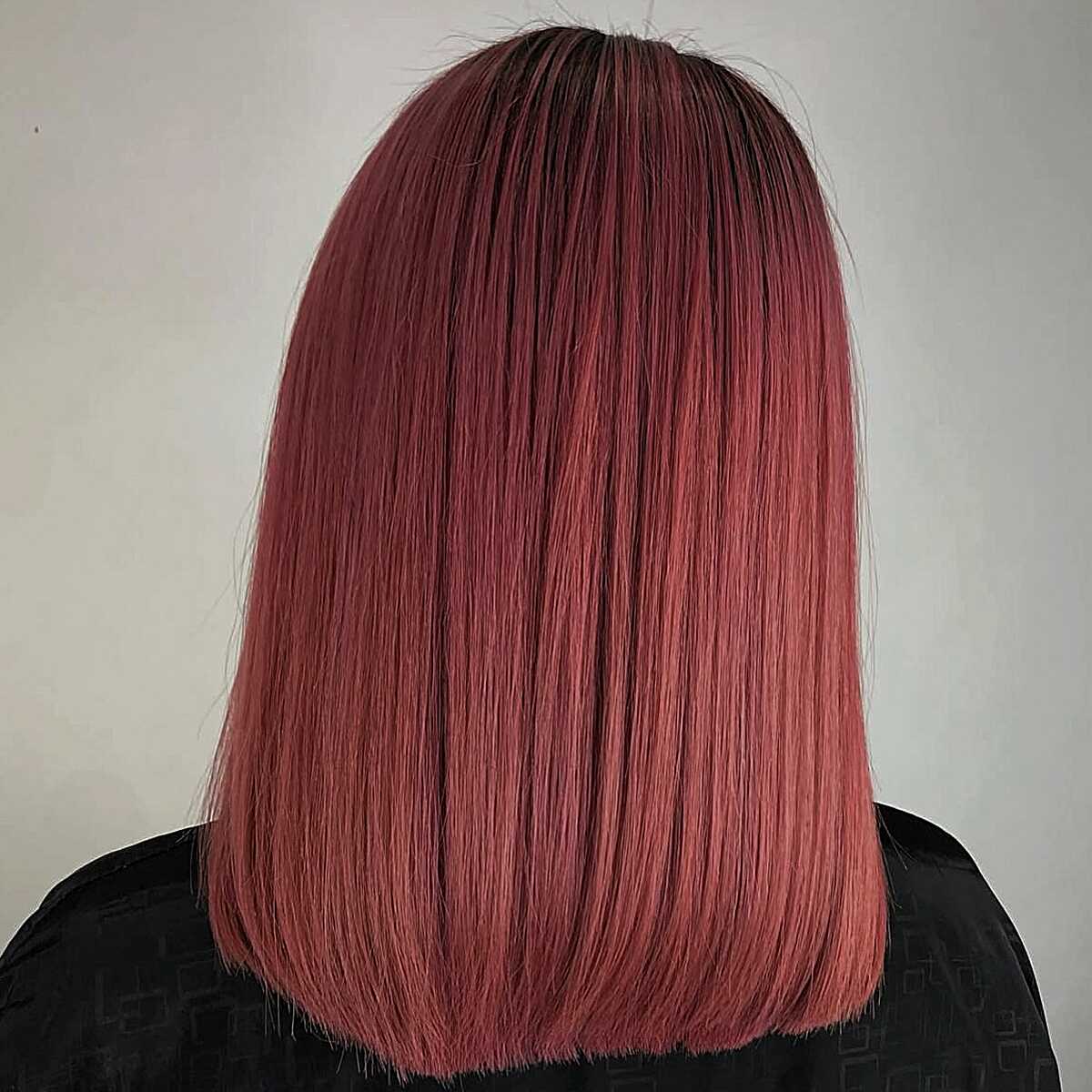 Straight dusty rose pink lob with dark roots