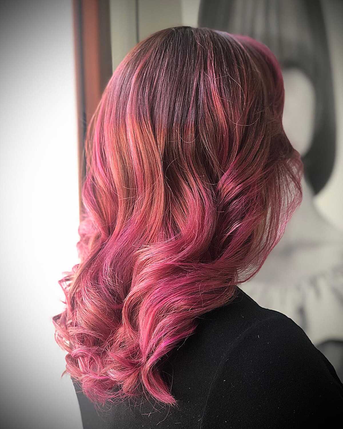 Dark root rose pink hair with vintage blowout curls