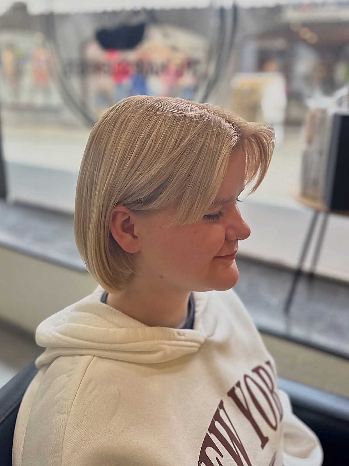 Creamy blonde side-parted bob on fine hair