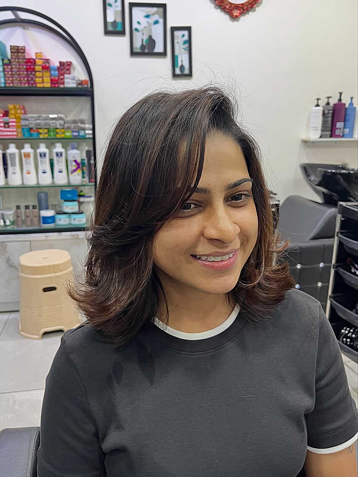 Layered dark brown bob with face-framing flipped ends
