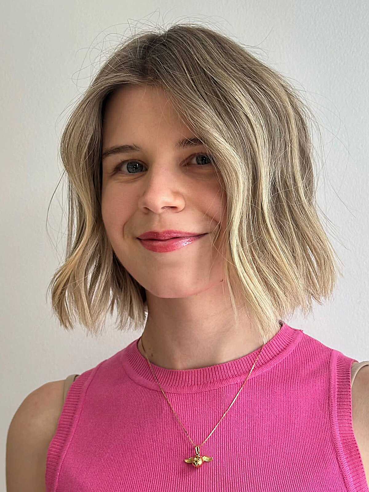 Lived-in dirty blonde bob with natural wavy texture