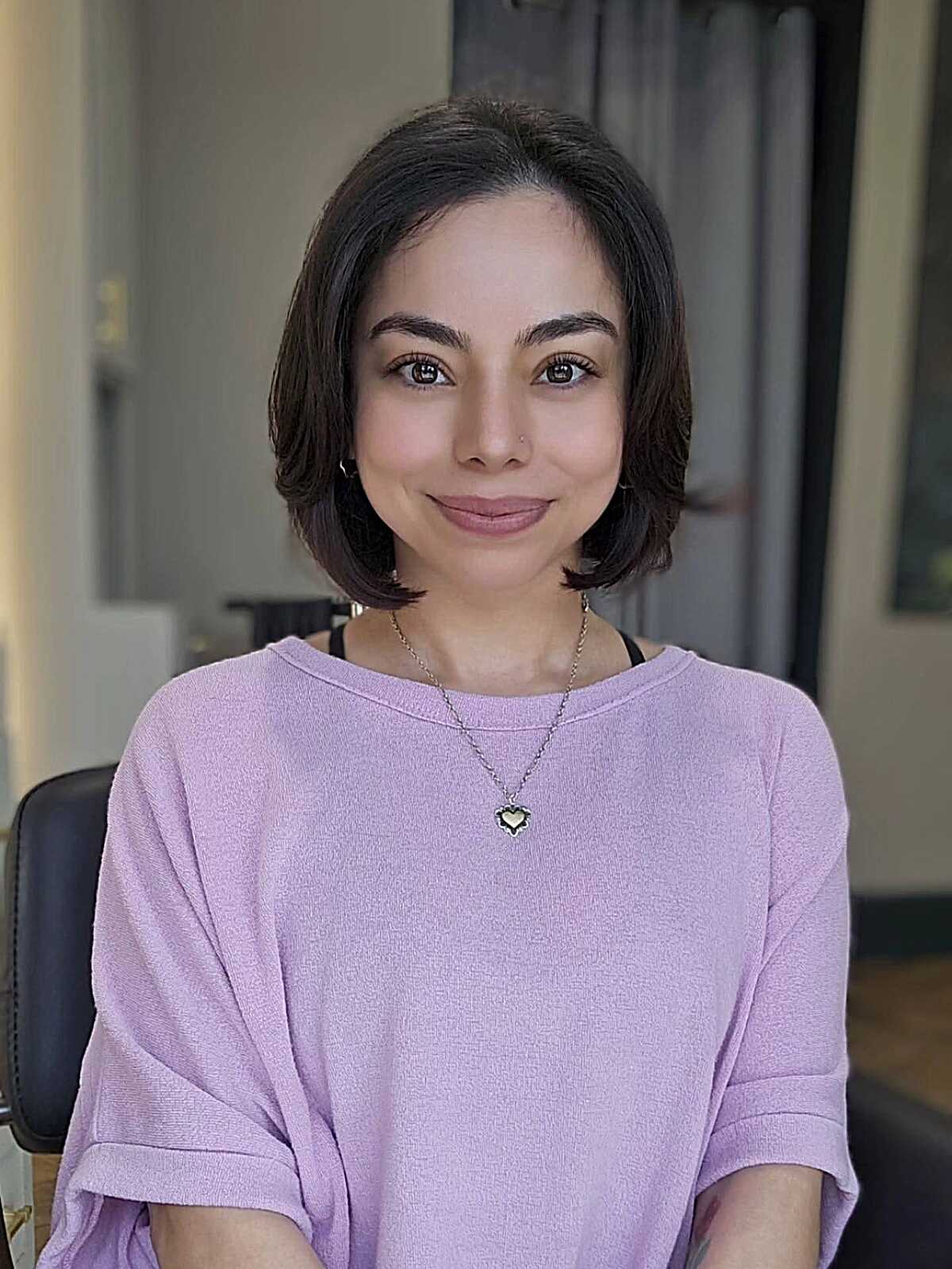 Simple soft dark brown bob just below the chin