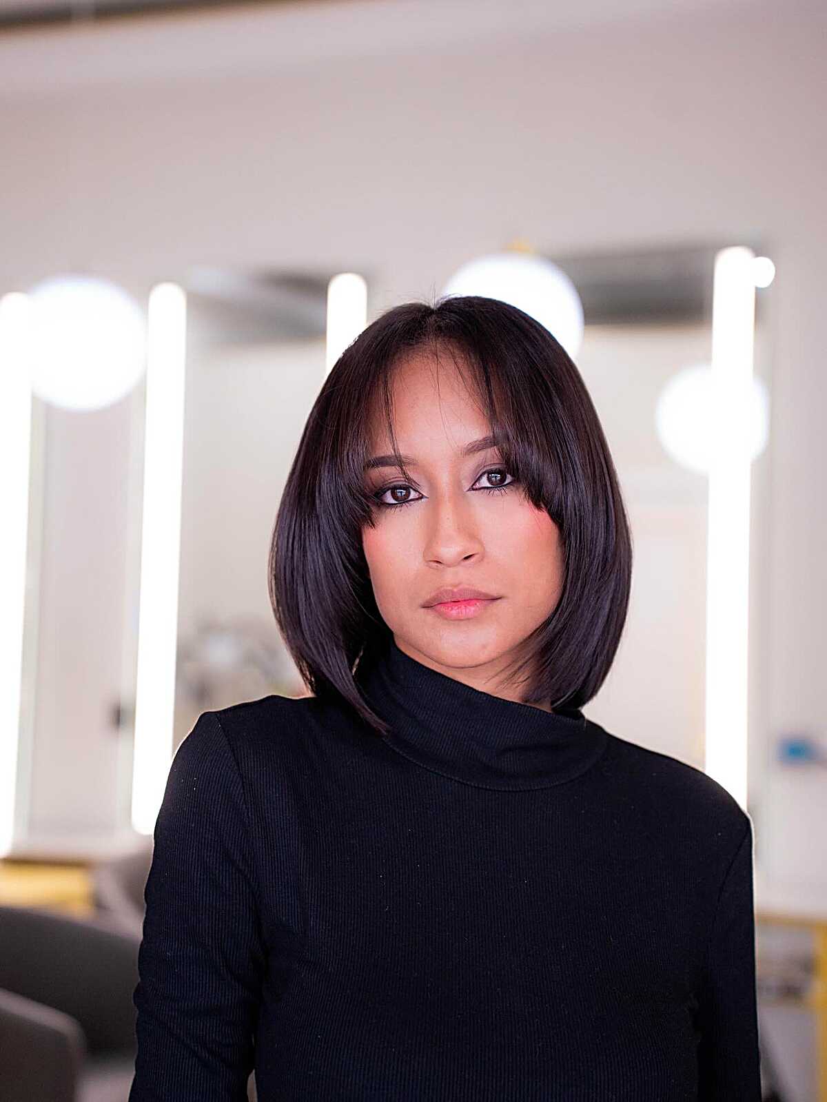 Dark brown side-swept bob with soft side bangs