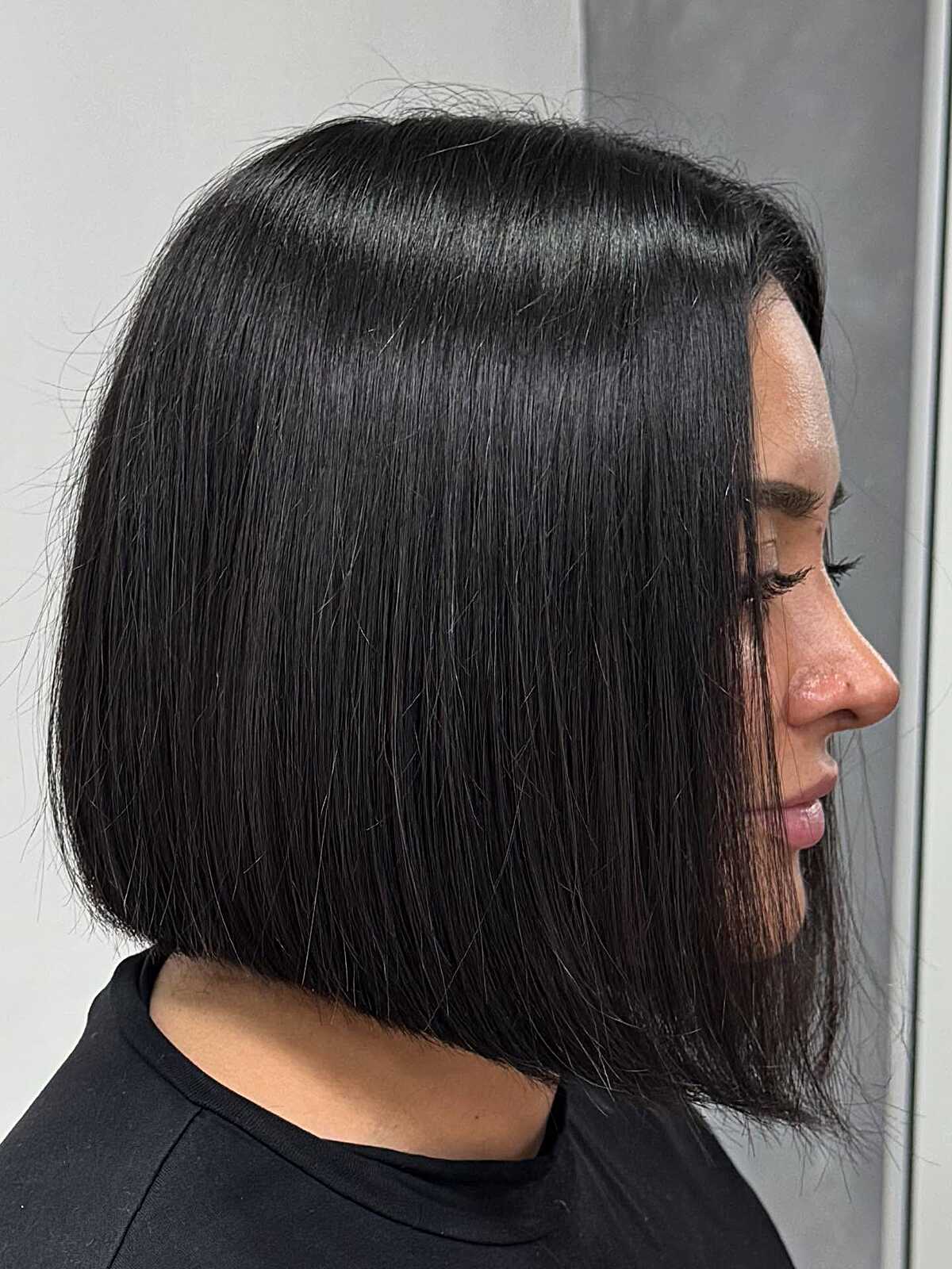 Sleek one-length black bob with blunt ends