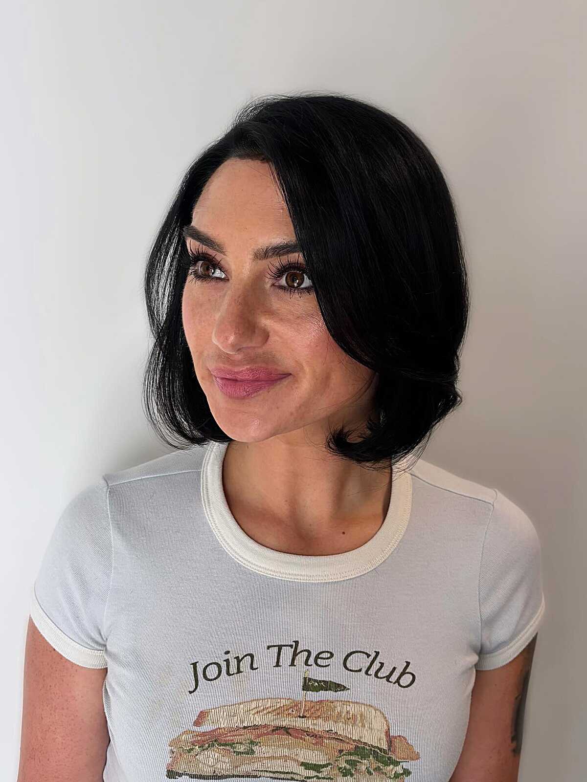 Soft black chin-length bob with flipped ends