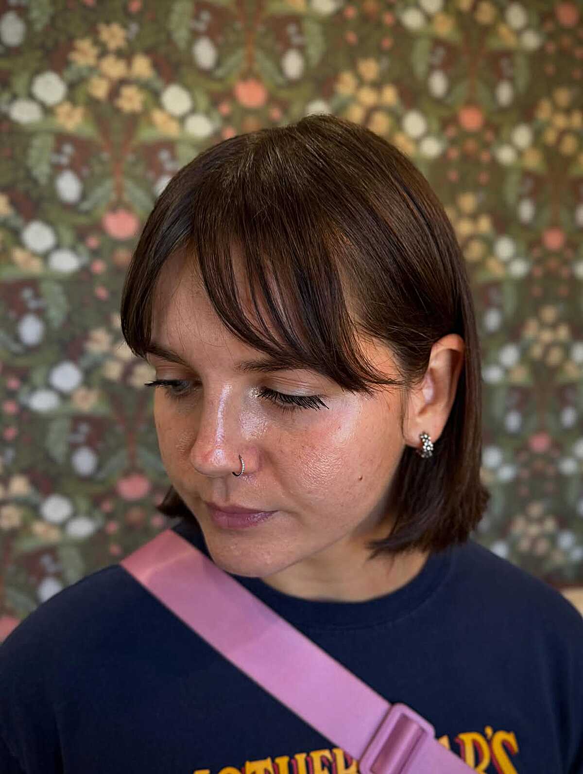 Warm chestnut bob with soft wispy fringe below the chin
