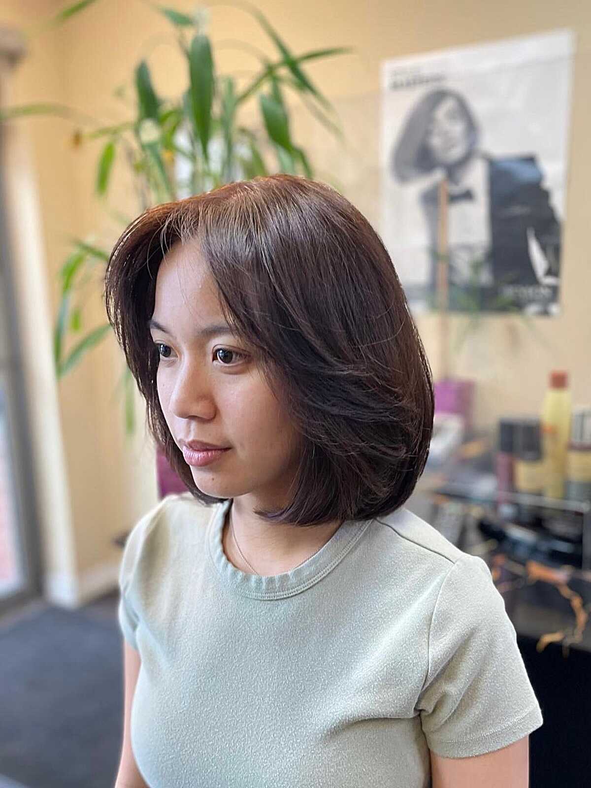 Medium brown layered bob with soft inward-curling ends