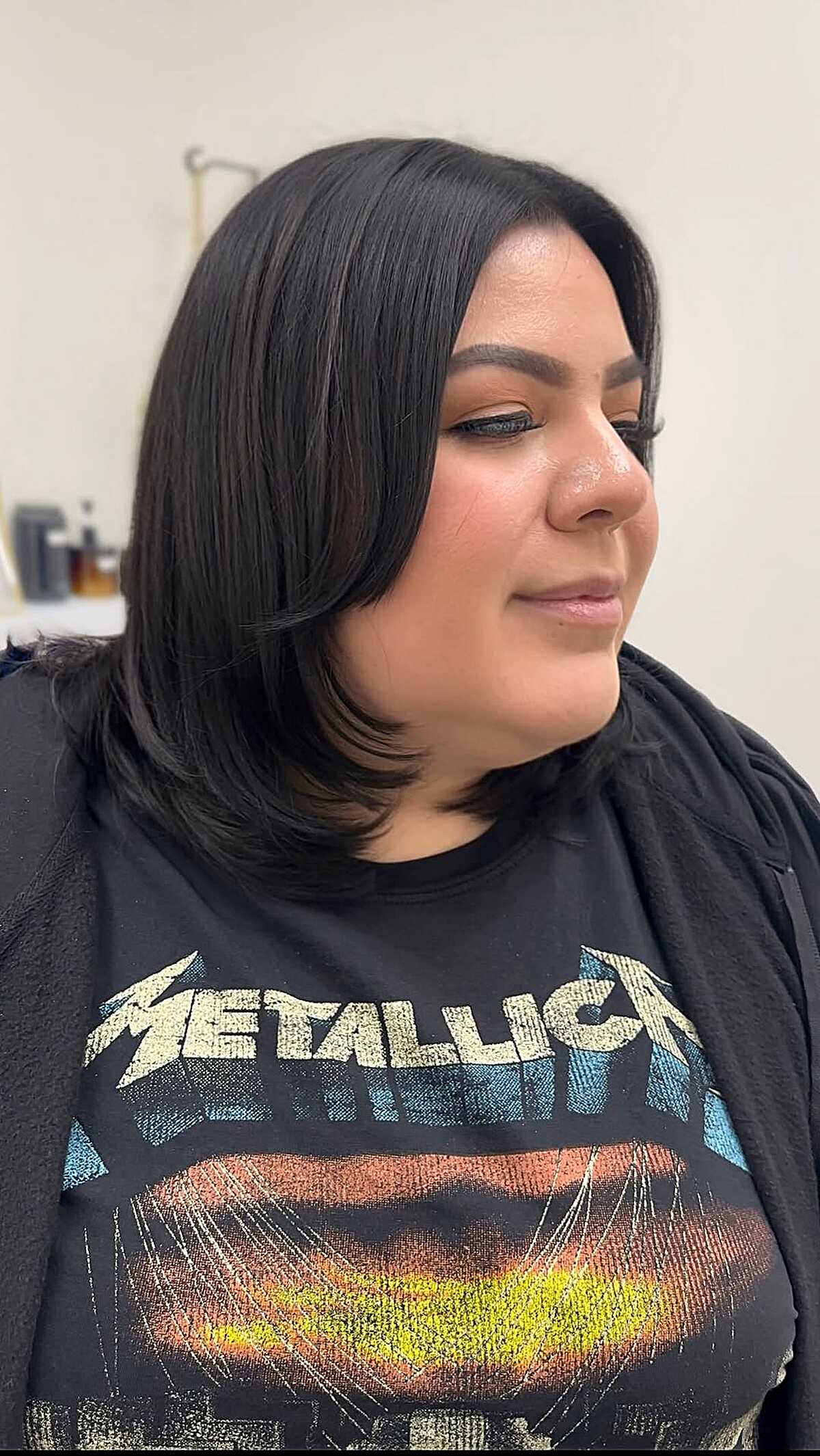 Black chin-length bob with face framing layers
