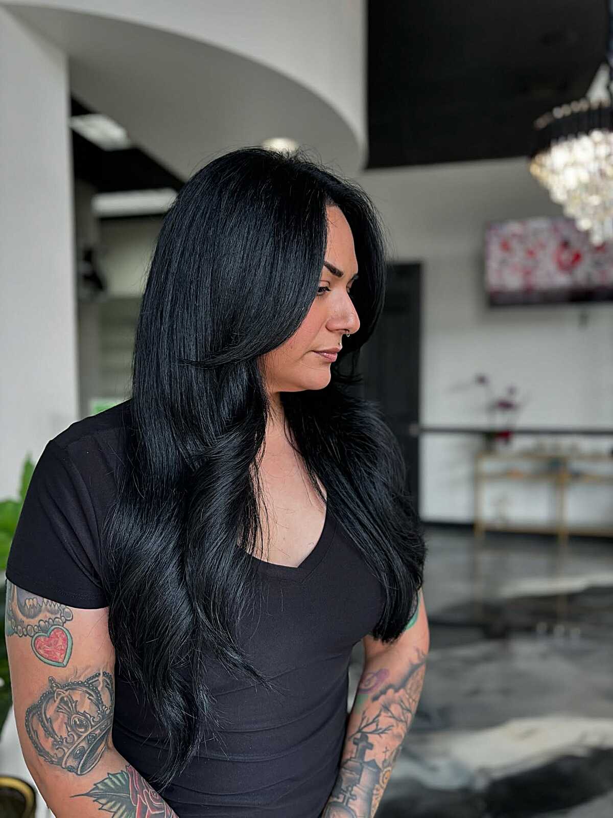 Extra long black hair with side-swept face framing layers