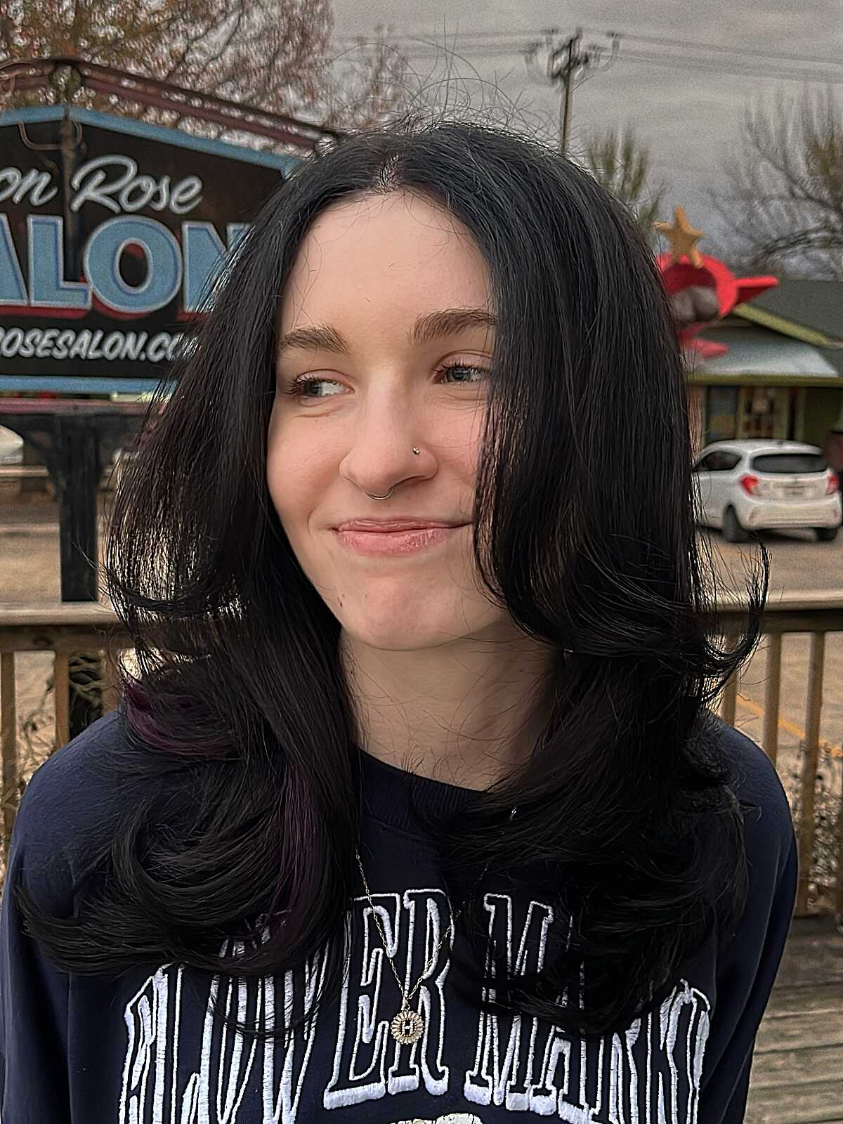 Shoulder length black hair with natural waves and layers