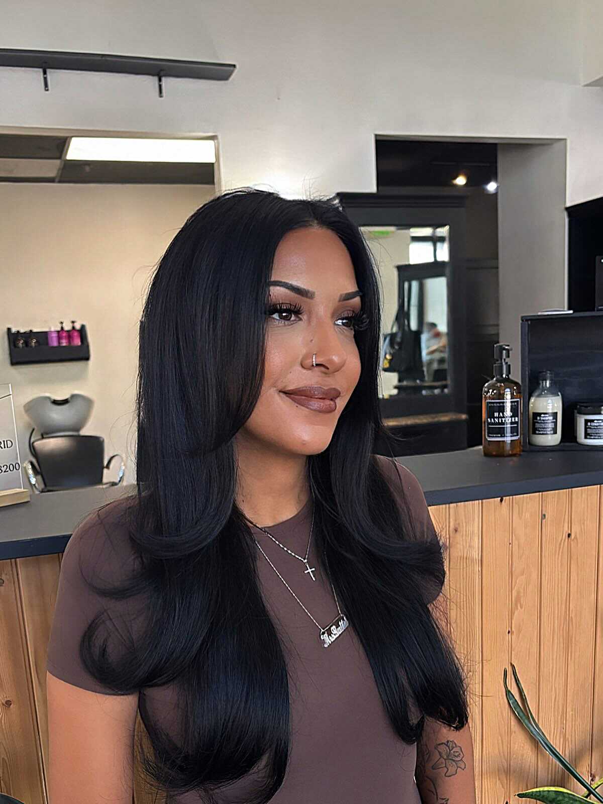 Long sleek black hair with subtle face framing layers