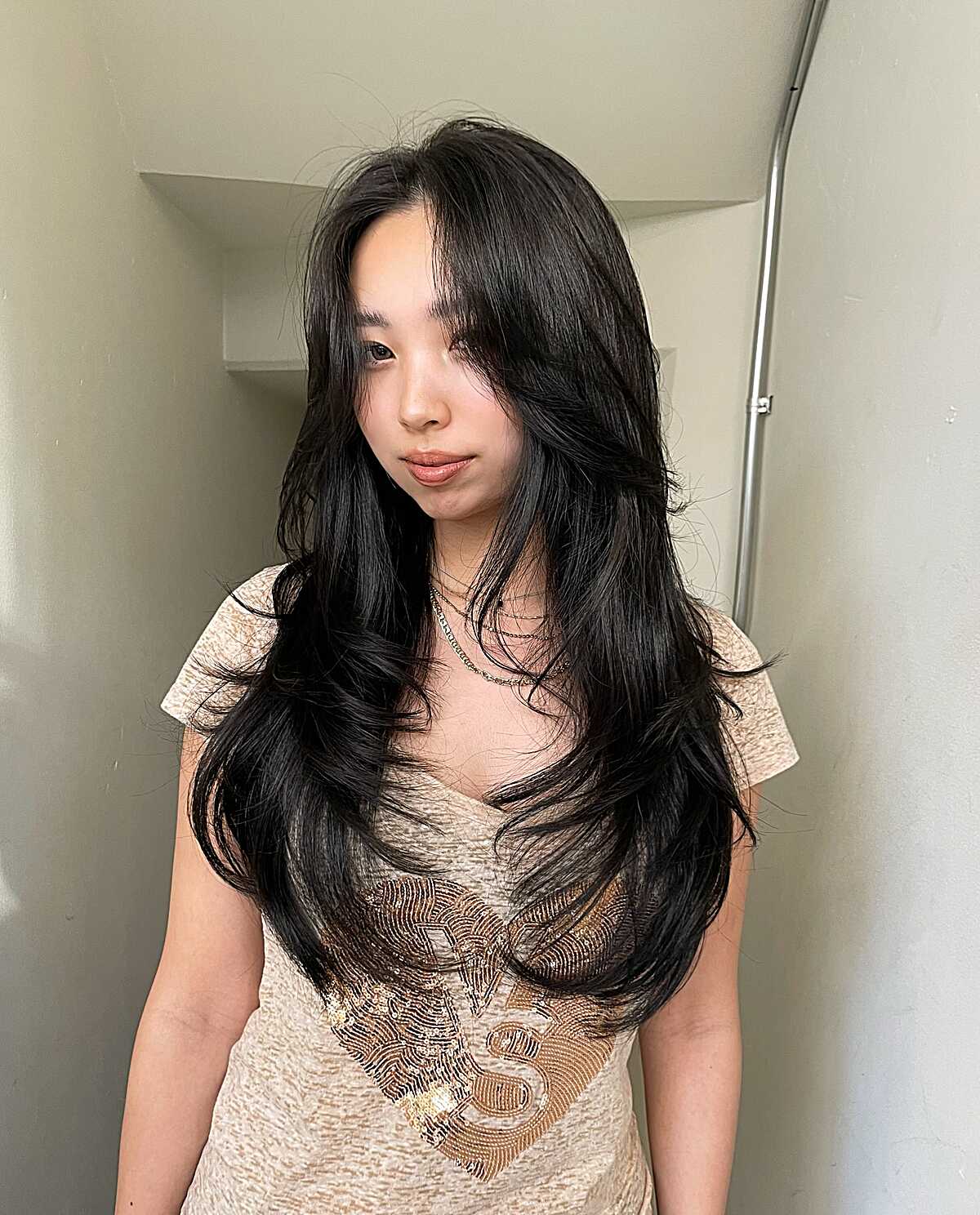 Long black hair with swoopy layers and lots of movement