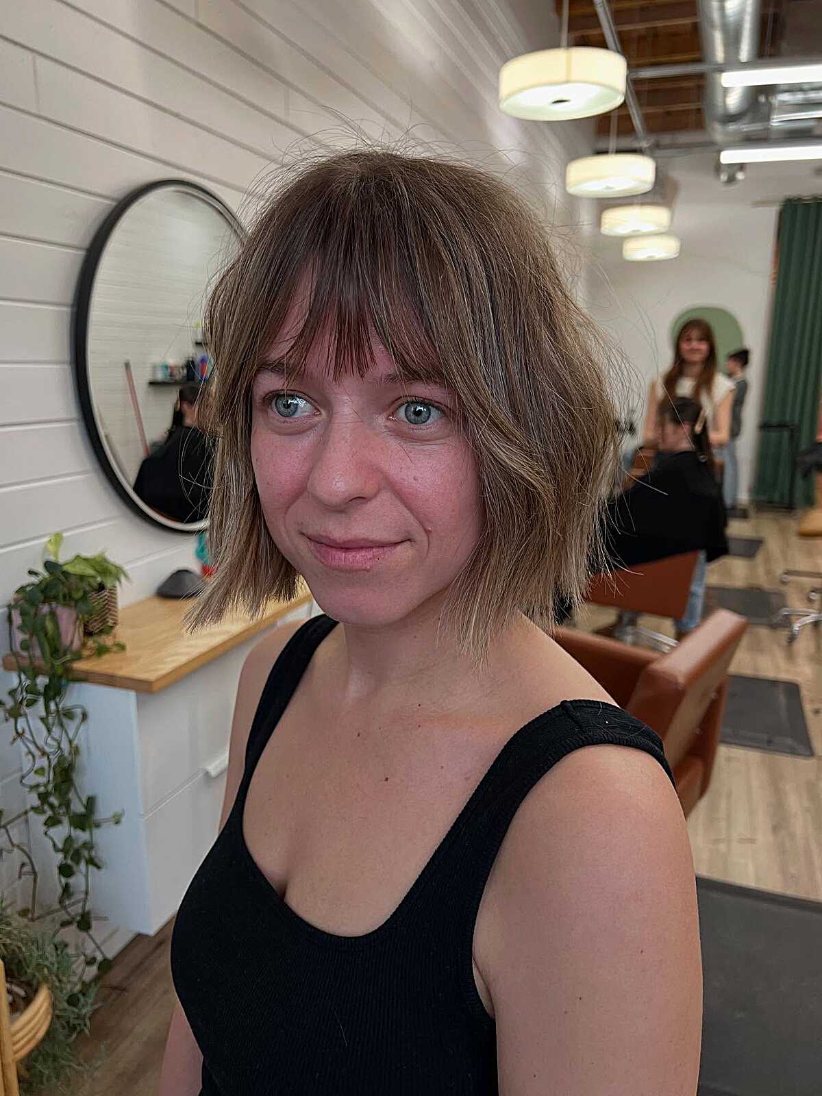 Ash brunette shaggy cowgirl bob with airy fringe