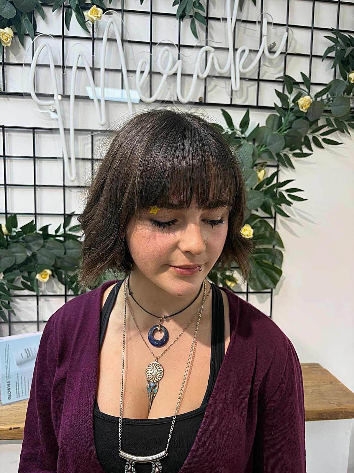 Cowgirl bob with choppy baby bangs and layered texture