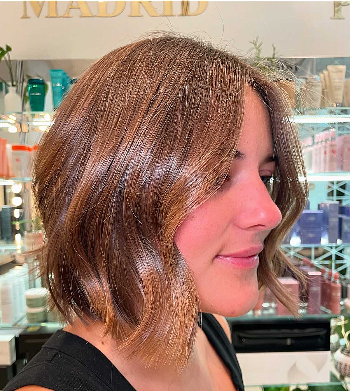 Cinnamon auburn cowgirl bob with soft bend in profile