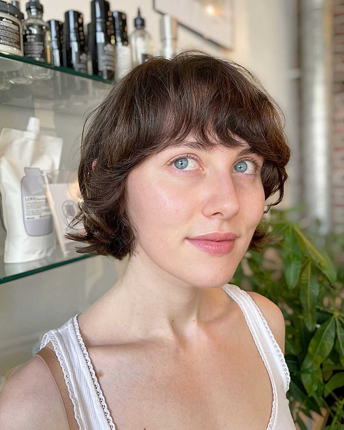 Feathered brunette cowgirl bob with natural wave