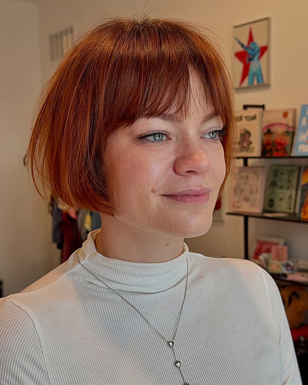 Fiery ginger micro cowgirl bob with straight bangs