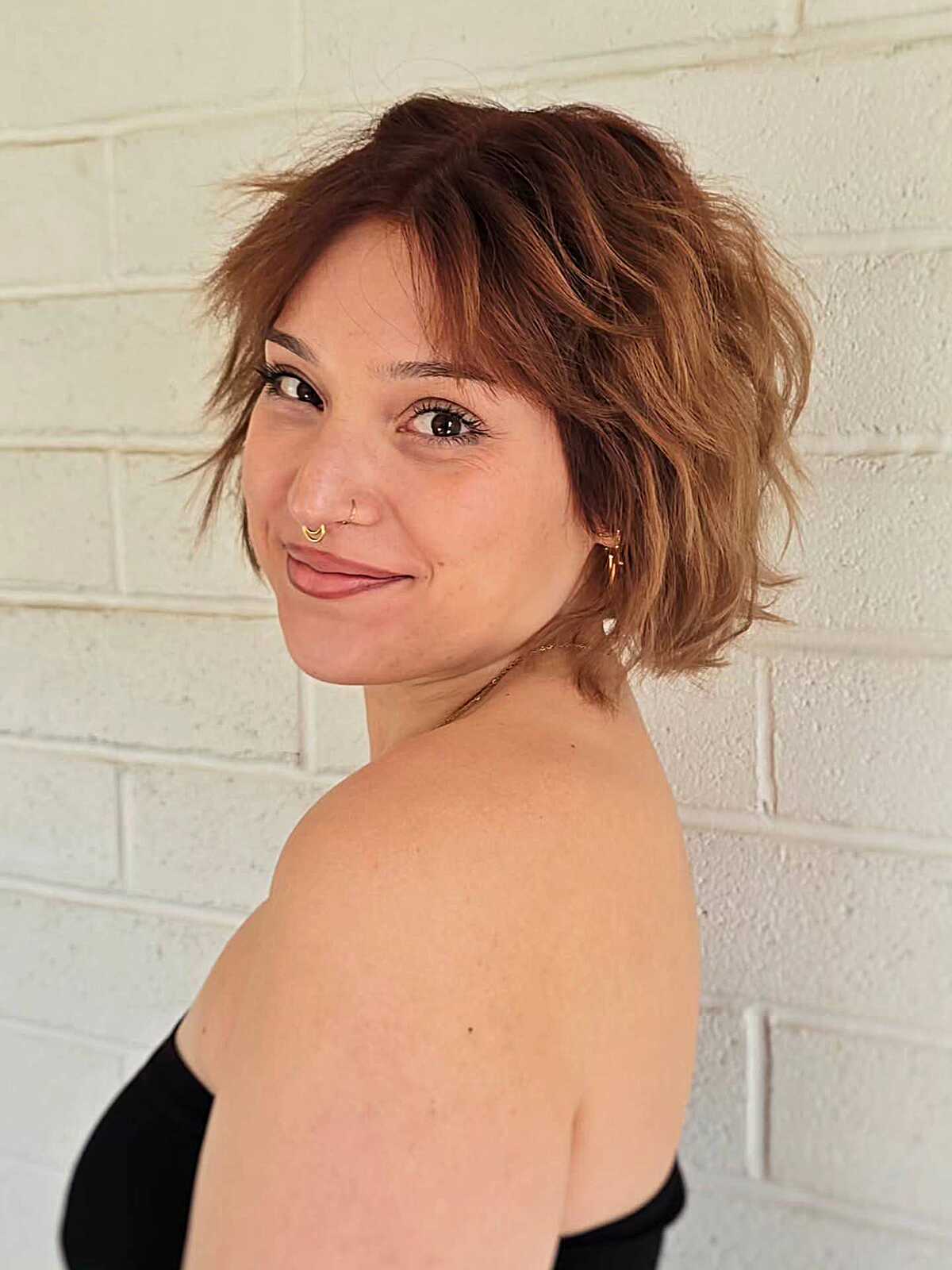 Messy choppy cowgirl bob with caramel highlights