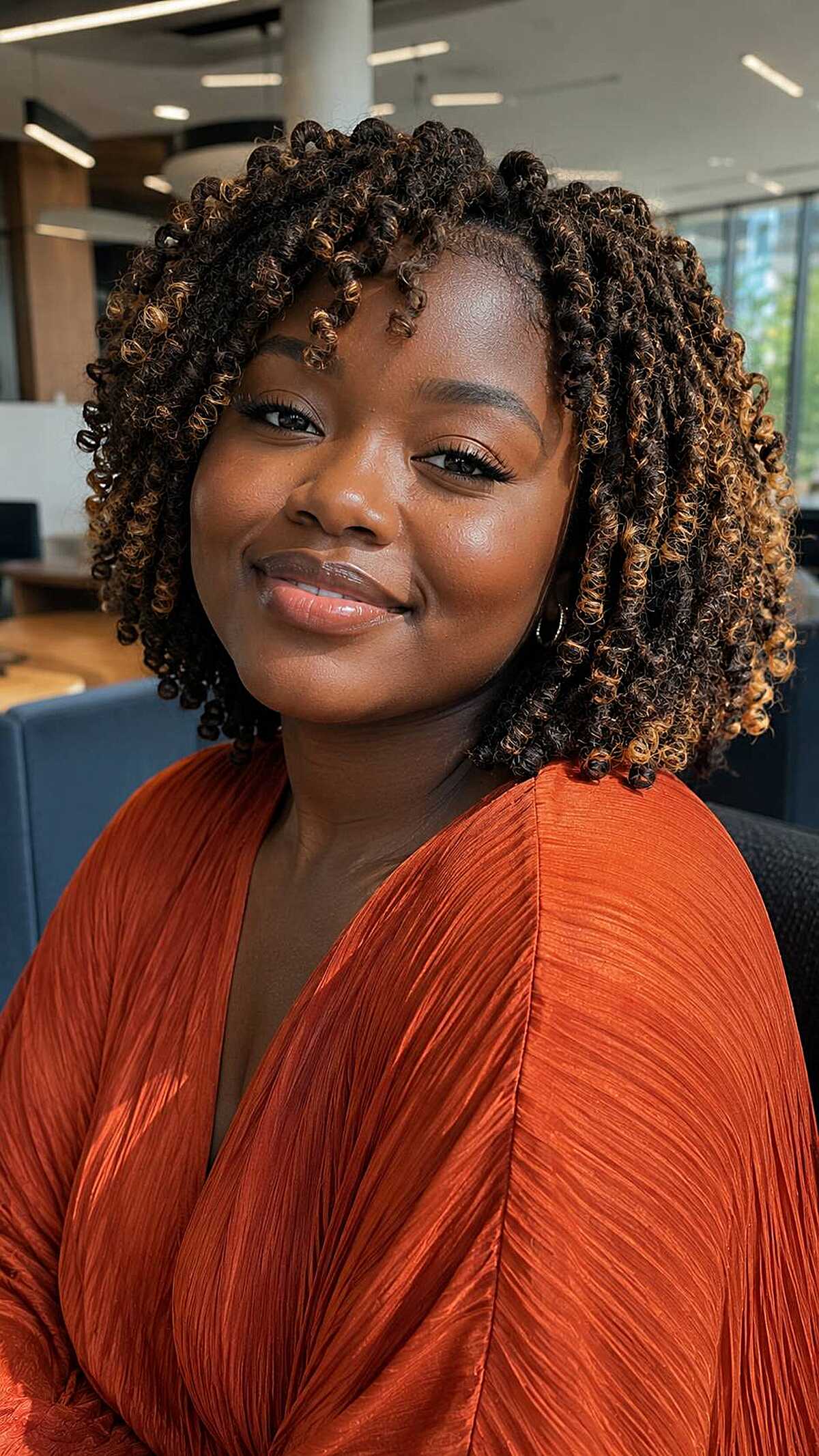 Short comb coils with golden blonde tips at bob length