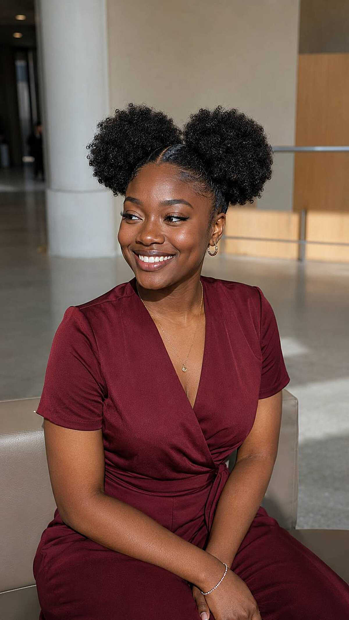 Two high afro puffs with natural 4C texture