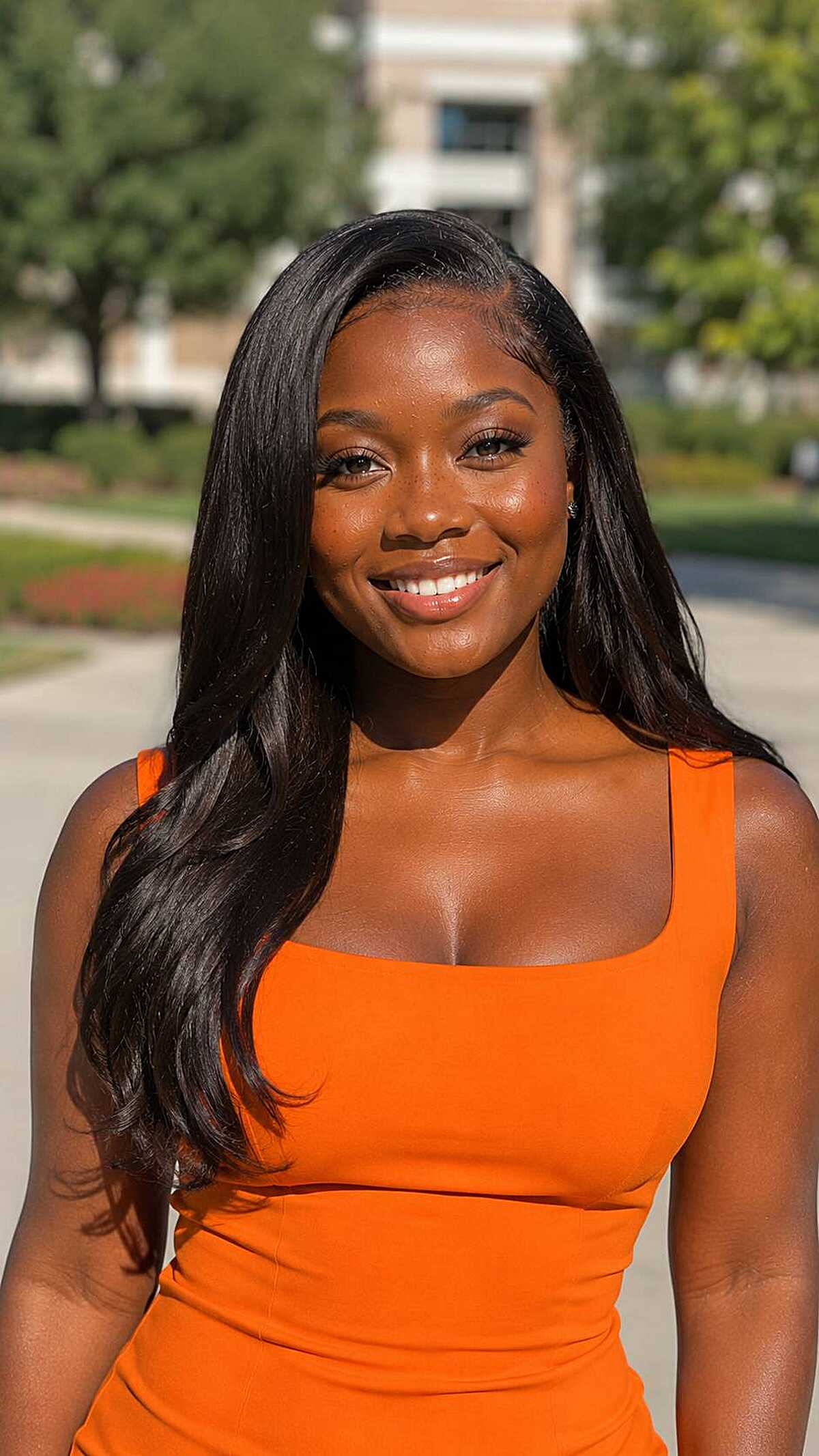Long straight middle-part silk press on dark hair