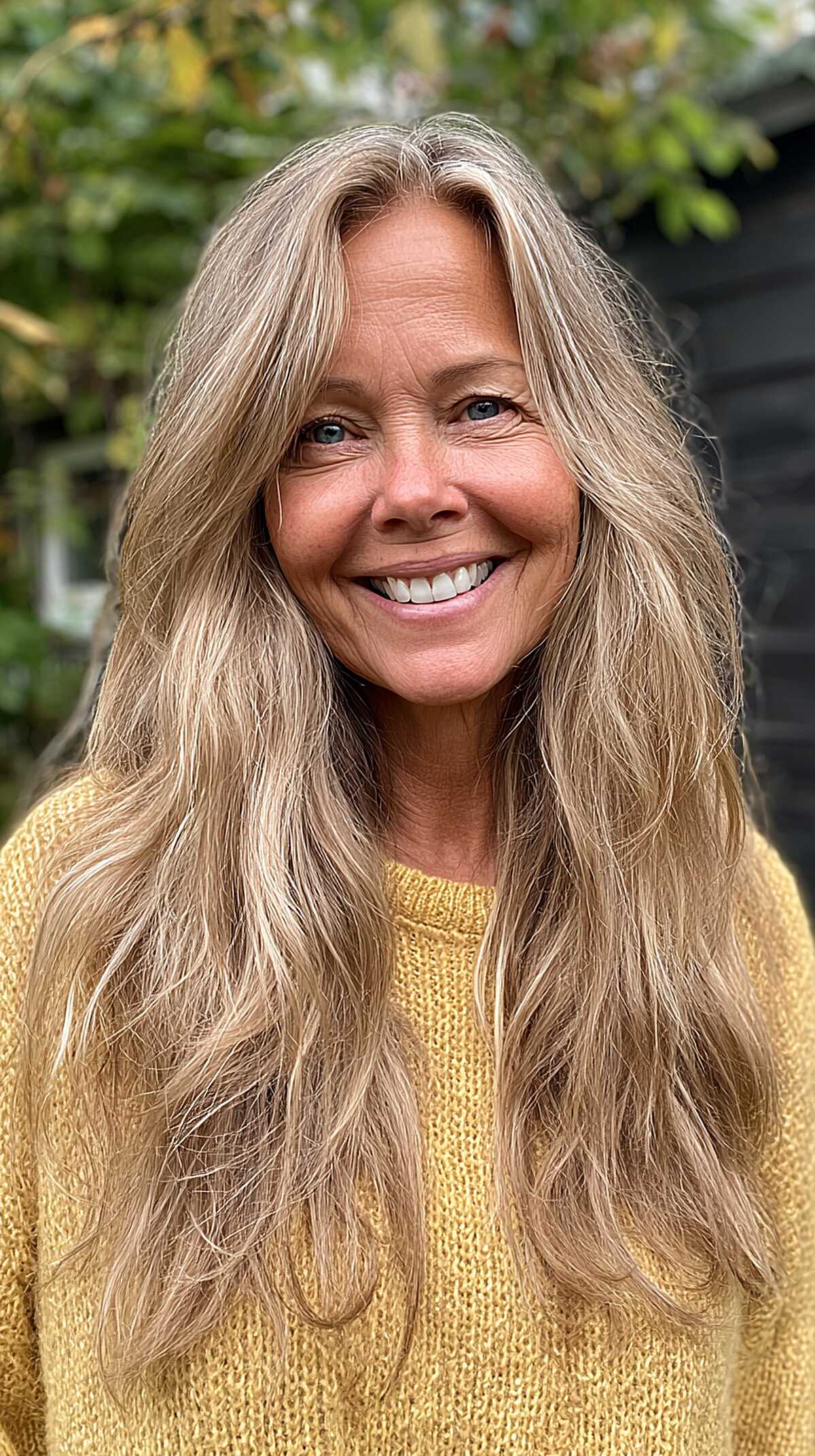 Long ash blonde hair with volume and tousled waves