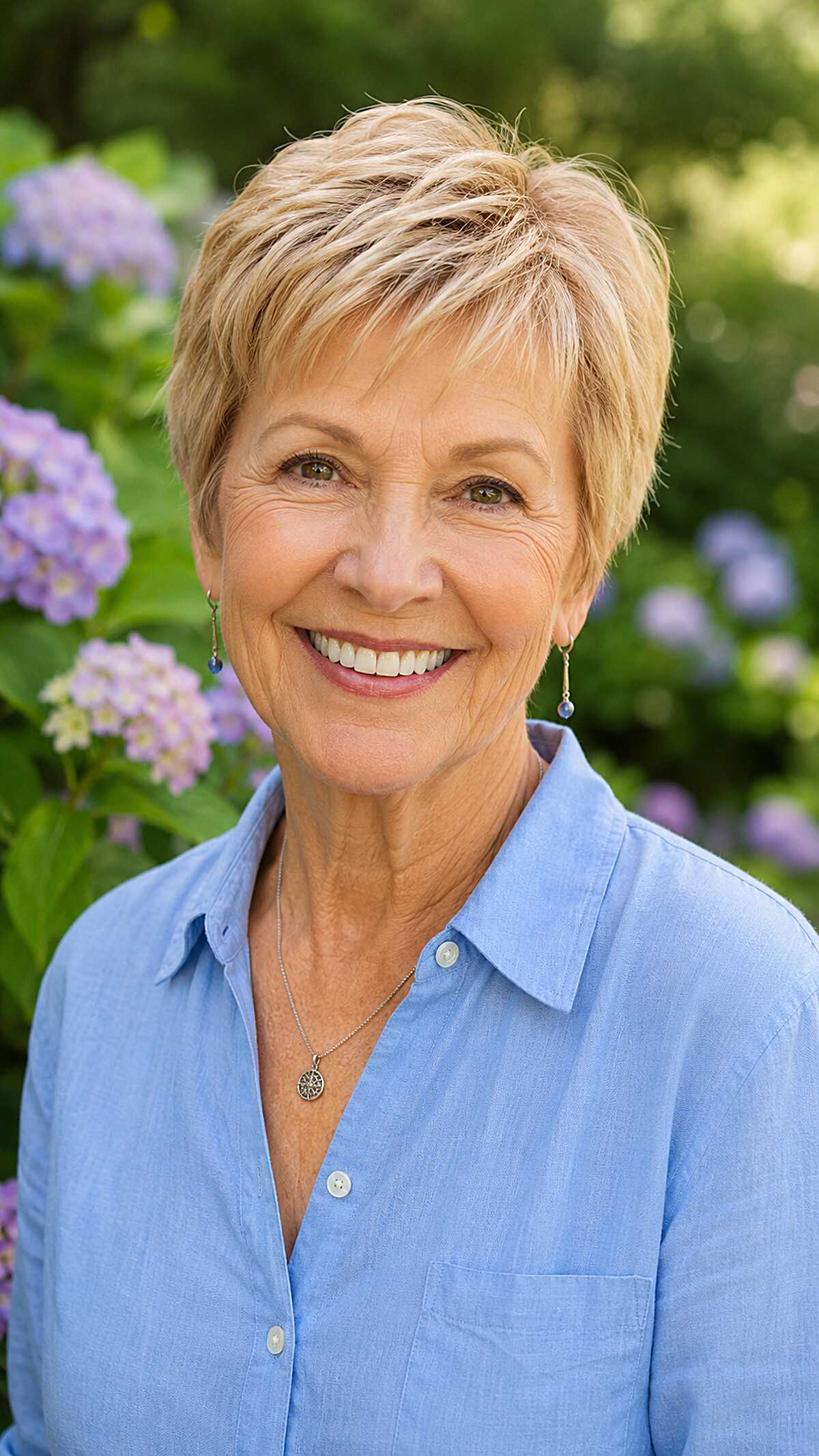 Honey blonde razor pixie with wispy layered bangs