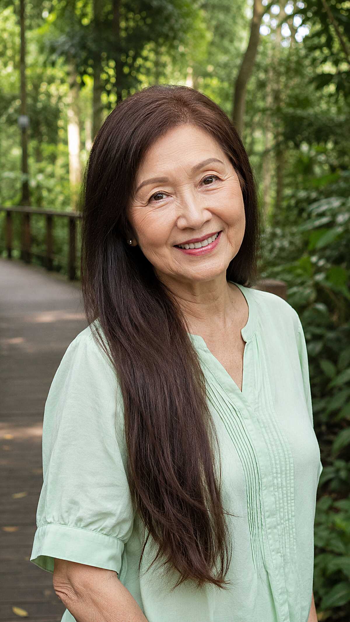 Long straight dark brown hair with a side part