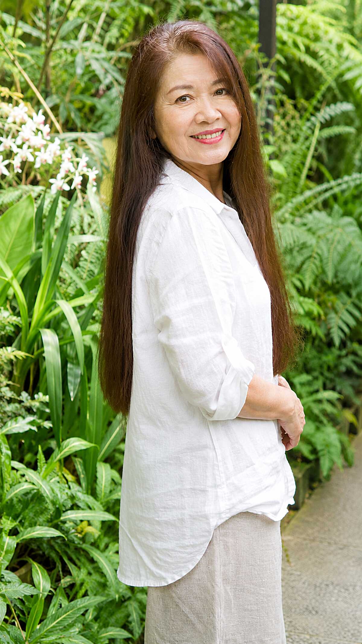 Very long straight chestnut hair seen from the side