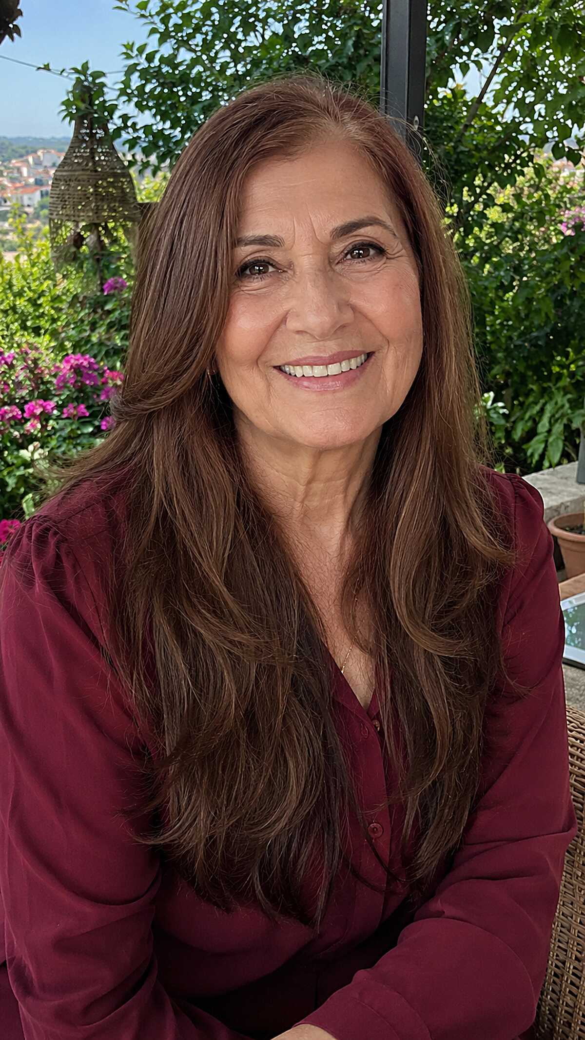 Long warm brunette hair worn naturally air-dried