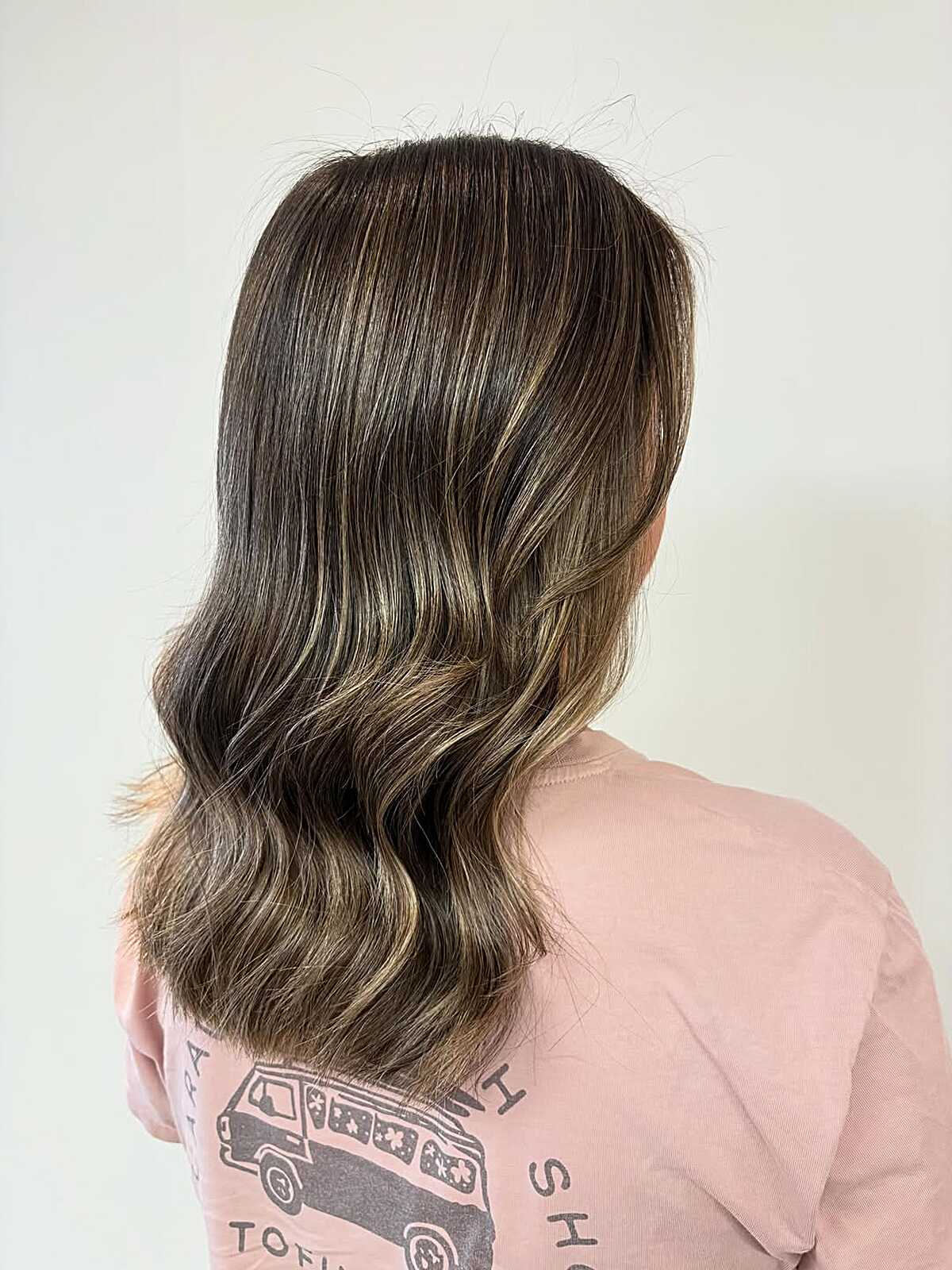 Dark brunette with ashy blonde balayage at the ends
