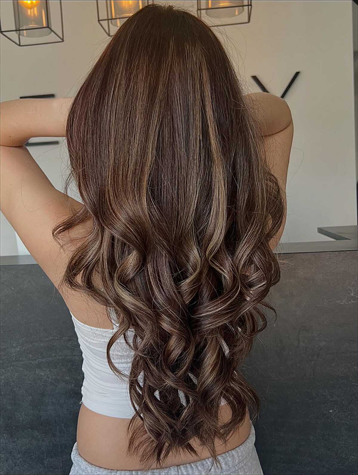 Long dark chocolate brunette with hidden warm balayage