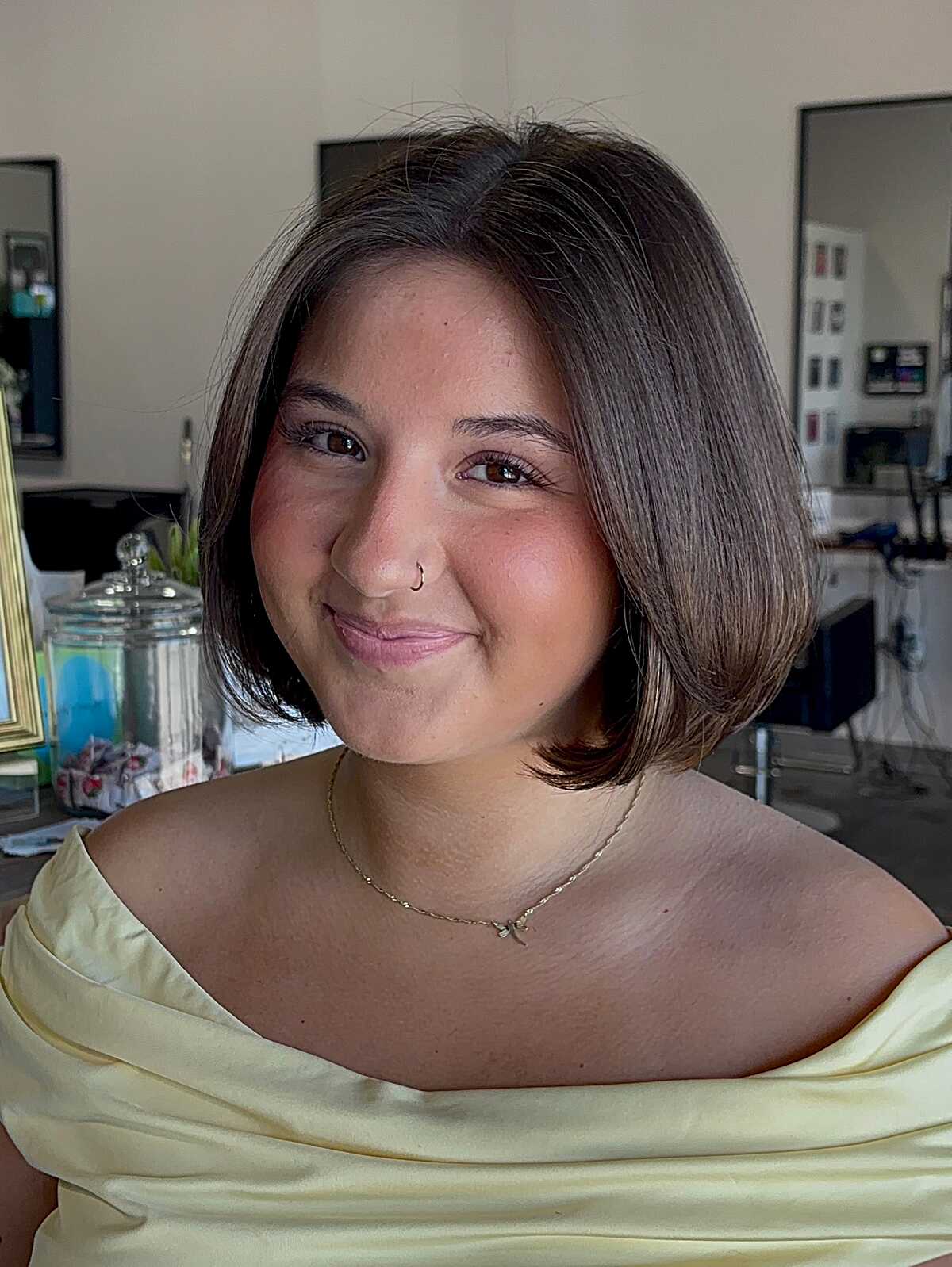 Sleek dark brown jaw-length bob with center part