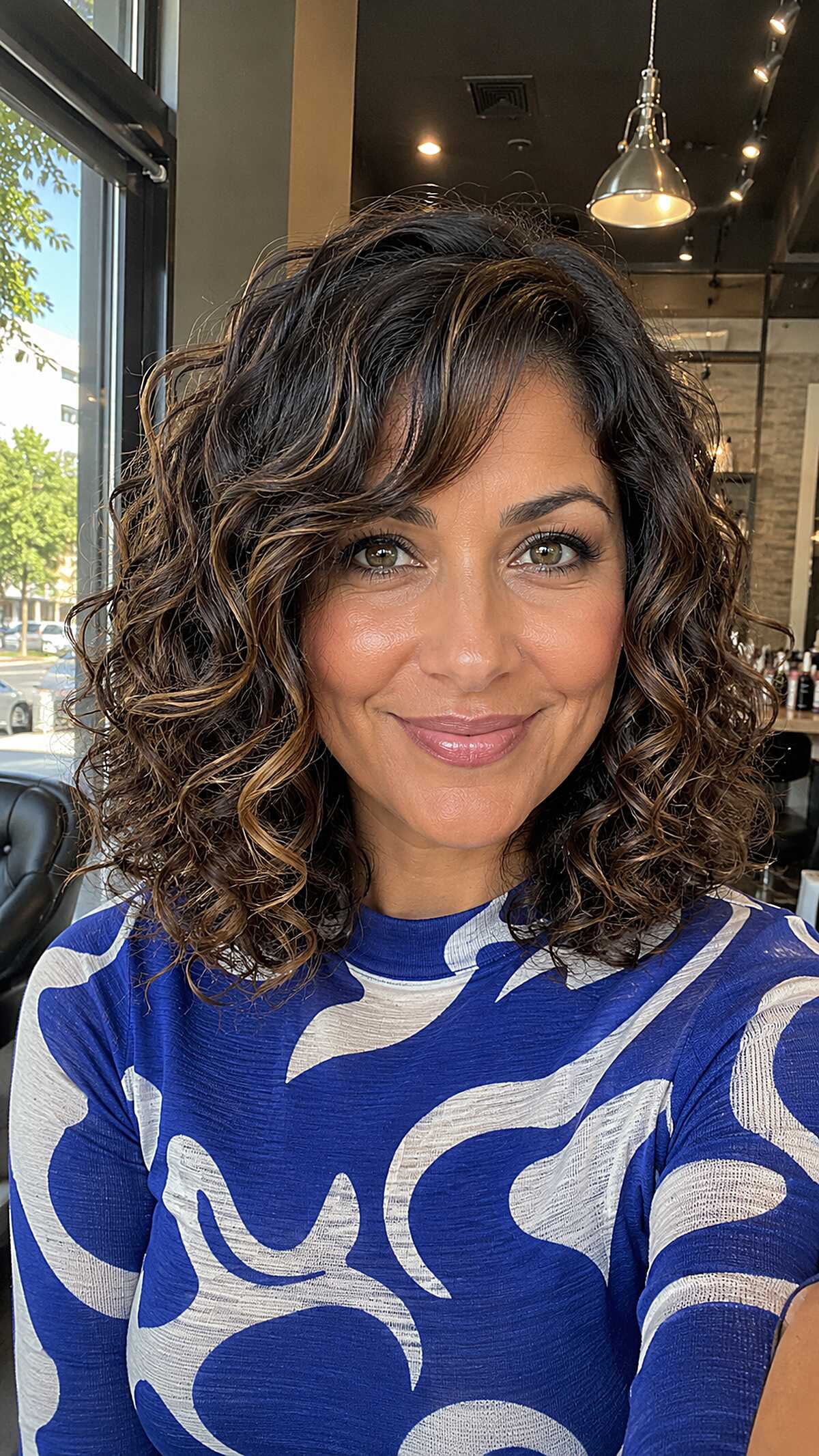 Collarbone Curly Cut with Toffee Balayage and Side-Swept Fringe