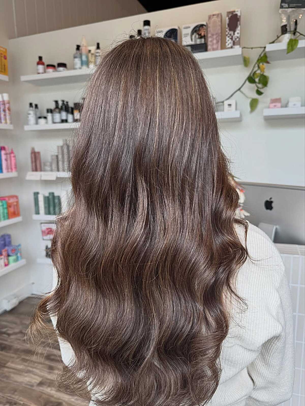 Long wavy brunette hair with cool ash balayage tones