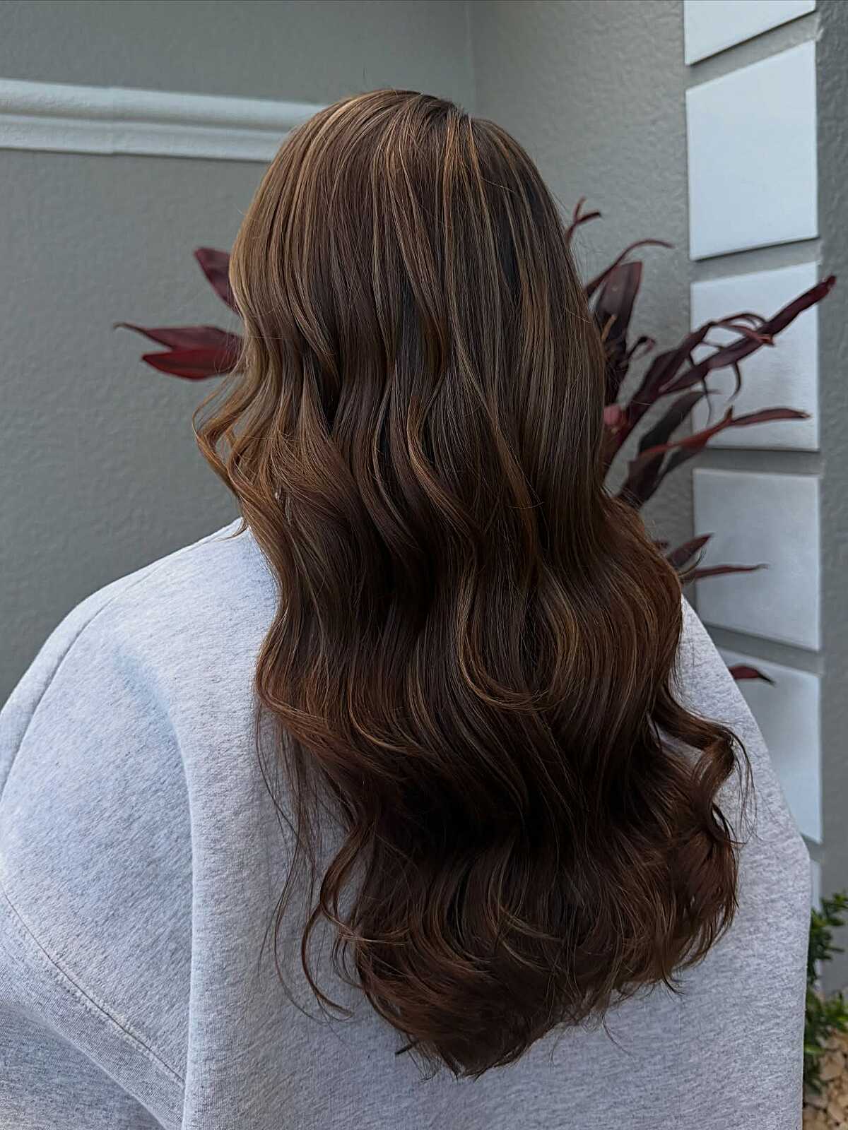 Dark mocha brunette with faint warm balayage ribbons